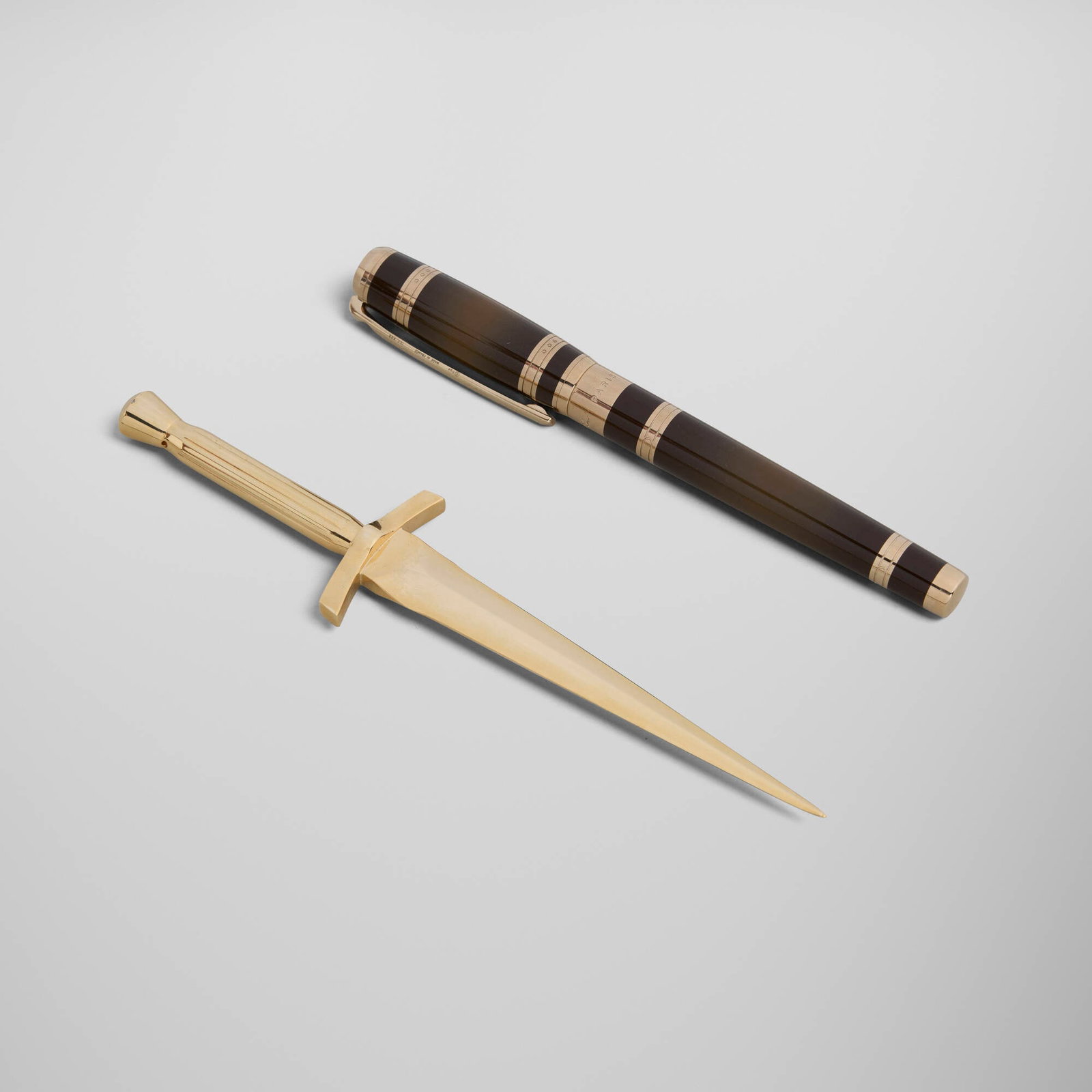 S.T. Dupont, Murder on the Orient Express rollerball pen and letter opener set: S.T. Dupont Murder on the Orient Express rollerball pen and letter opener set France, 2017 lacquer, gold-plated metal 6.75 h x 1.5 w x 0.25 d in (17 x 4 x 1 cm) 5.25 h x 0.5 w x 0.5 d in (13 x 1 x