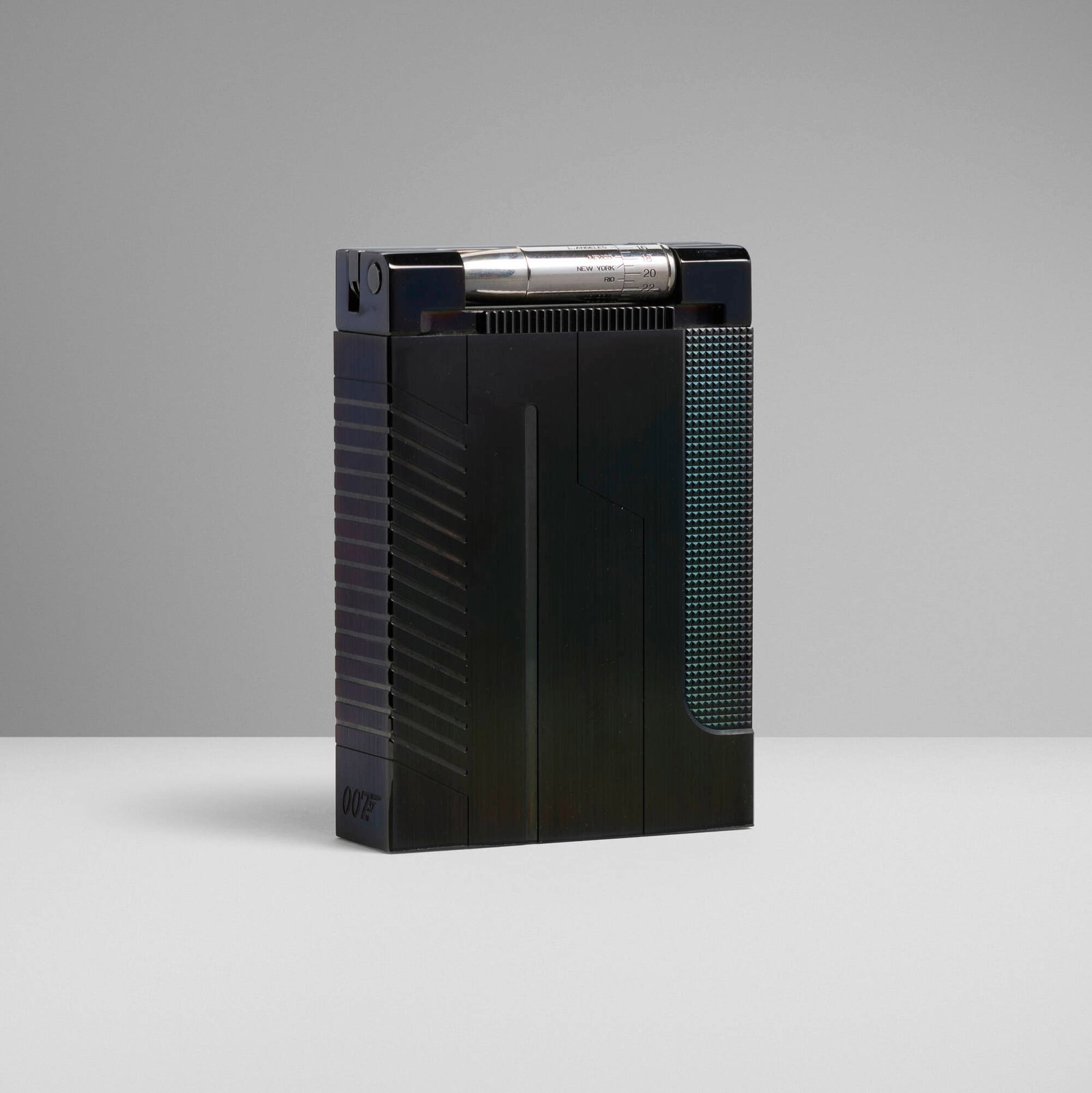 S.T. Dupont, James Bond 007 jeroboam table lighter: S.T. Dupont James Bond 007 jeroboam table lighter France, 2004 PVD plated metal 4 h x 2.75 w x 0.75 d in (10 x 7 x 2 cm) Impressed manufacturer's mark and number '352/707 S.T. Dupont