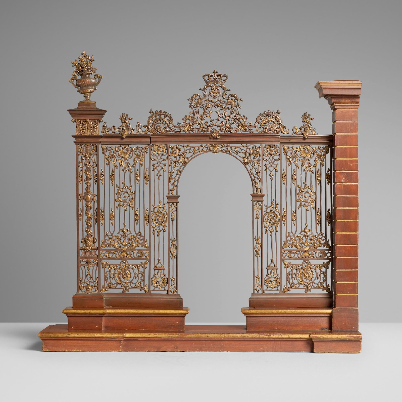After Jean Lamour, Fine model of ironwork for the entrance corners of the Place Royal of Nancy: After Jean Lamour Fine model of ironwork for the entrance corners of the Place Royal of Nancy bronze, walnut 24.5 h x 25.75 w x 5.5 d in (62 x 65 x 14 cm) An example of the etching showing this