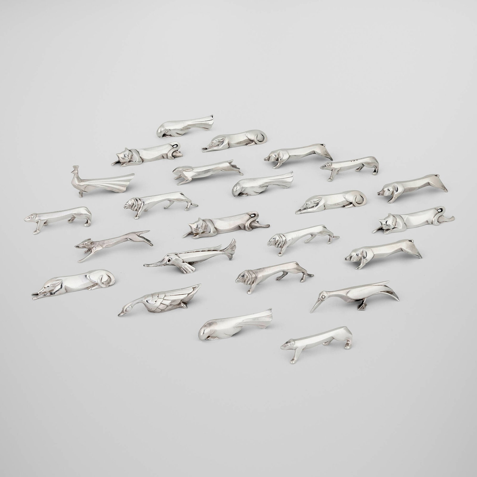 Edouard-Marcel Sandoz, Gallia animalier knife rests, set of twenty-four: Edouard-Marcel Sandoz Gallia animalier knife rests, set of twenty-four Christofle Switzerland, c. 1930 silver-plated metal largest: 1.75 h x 3.25 w x 0.75 d in (4 x 8 x 2 cm) smallest: 1 h x 3.25 w x
