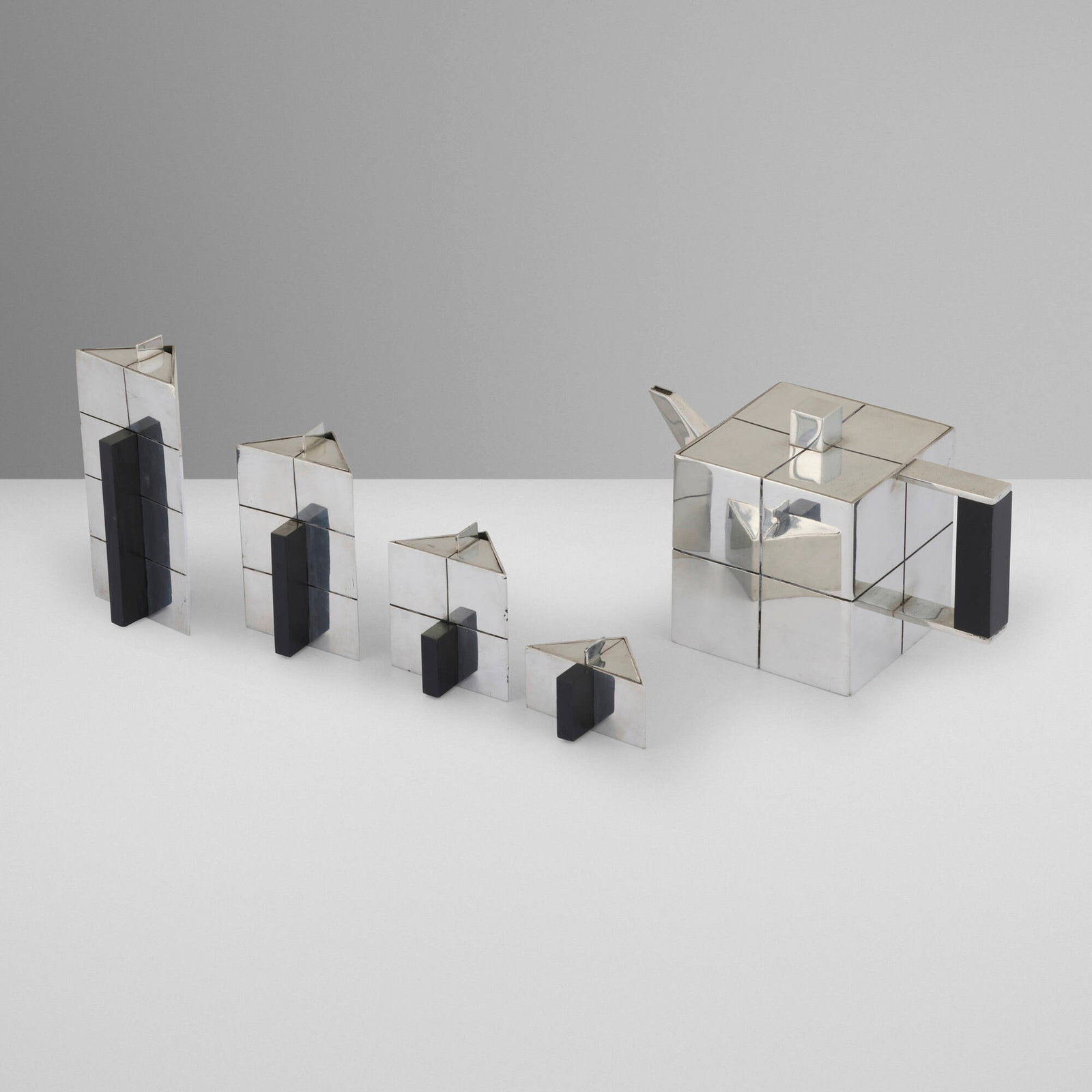 Pascal Morabito, Convergences five-piece tea service: Pascal Morabito Convergences five-piece tea service Etain & Prestige France, c. 1979 pewter, wood tallest: 6.75 h x 3.25 w x 2.375 d in (17 x 8 x 6 cm) shortest: 1.875 h x 3.125 w x 2.375 d in (5 x 8