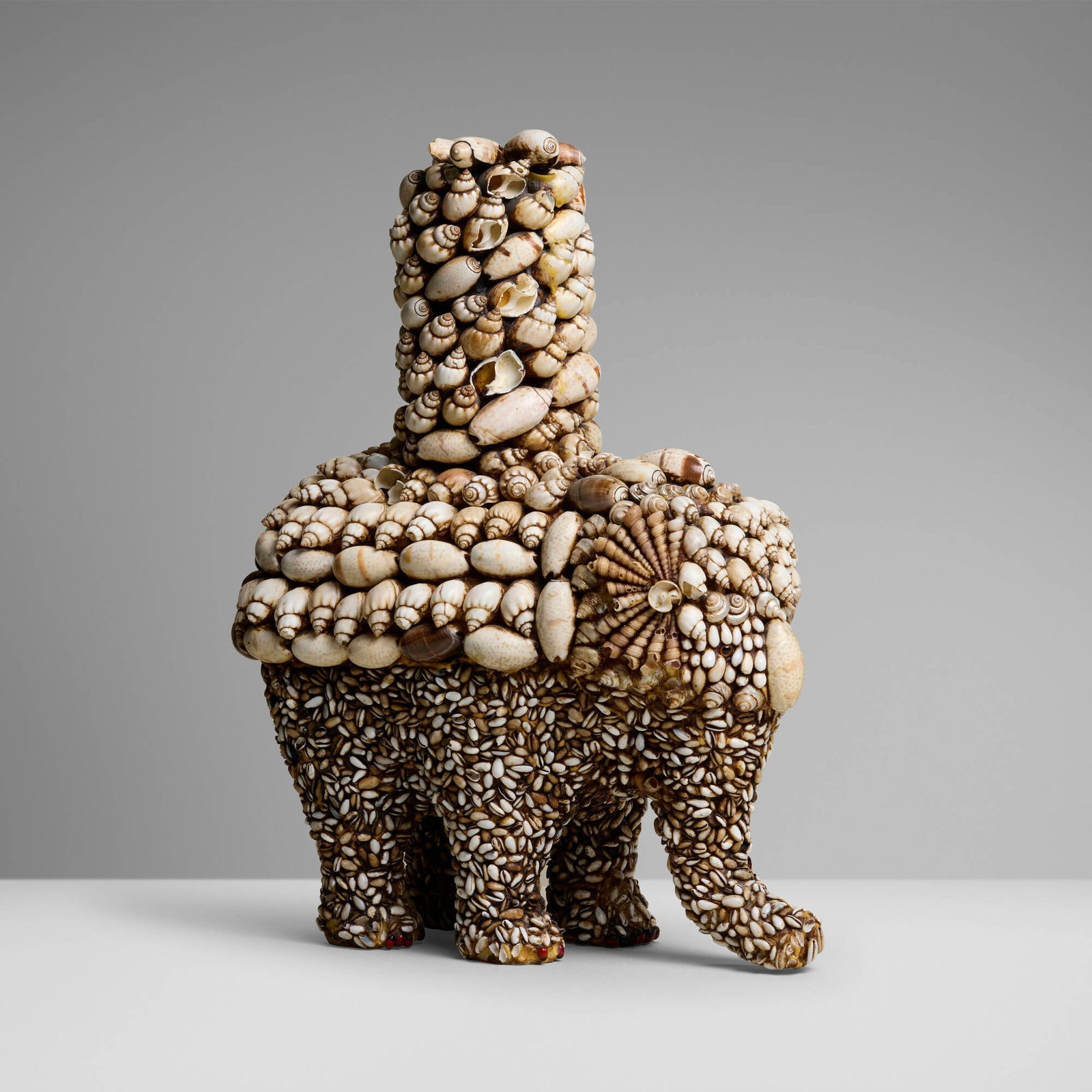 J. Antony Redmile, Unique elephant-form box: J. Antony Redmile Unique elephant-form box United Kingdom, c. 1970 seashells, rosary peas, glass cabochons, resin 14 h x 10.75 w x 6 d in (36 x 27 x 15 cm) This work will ship from Lambertville, New
