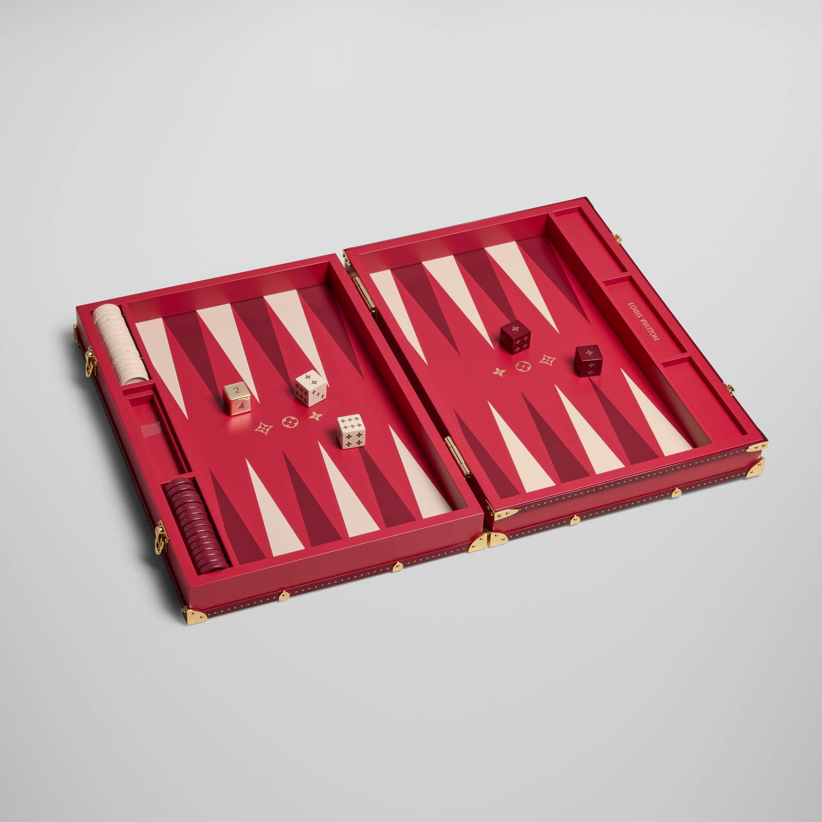 Louis Vuitton, Backgammon set: Louis Vuitton Backgammon set France, 2026 resin, mahogany, gilt base metal open: 1.5 h x 18.25 w x 13 d in (4 x 46 x 33 cm) closed: 2.875 h x 9.125 w x 13 d in (7 x 23 x 33 cm) Lot includes one