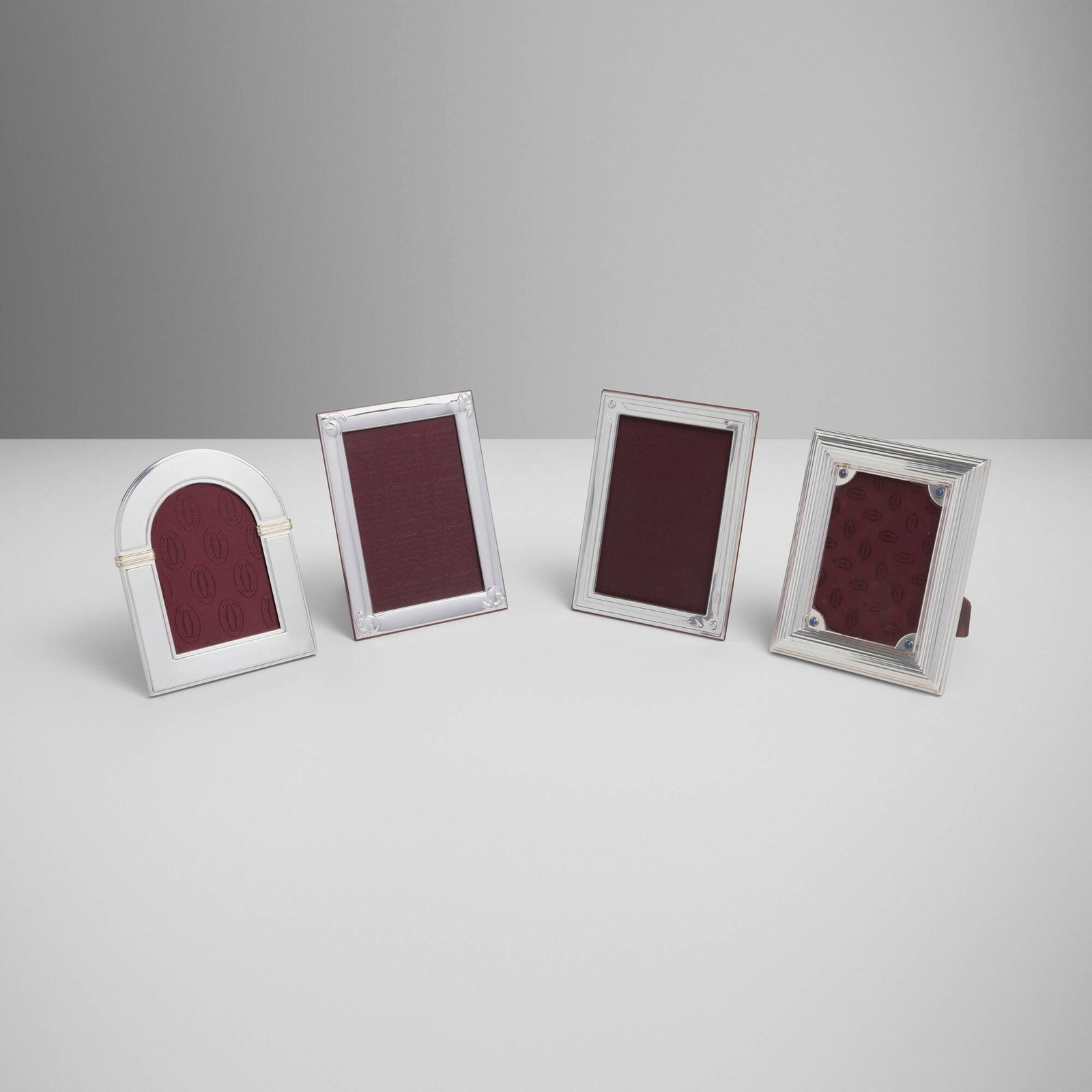 Cartier, Collection of four picture frames: Cartier Collection of four picture frames France / Spain, c. 1990 silver-plated and parcel-gilt metal, sterling silver, glass, leather, lapis lazuli, wood largest: 7 h x 5.5 w x 4.25 d in (18 x 14 x
