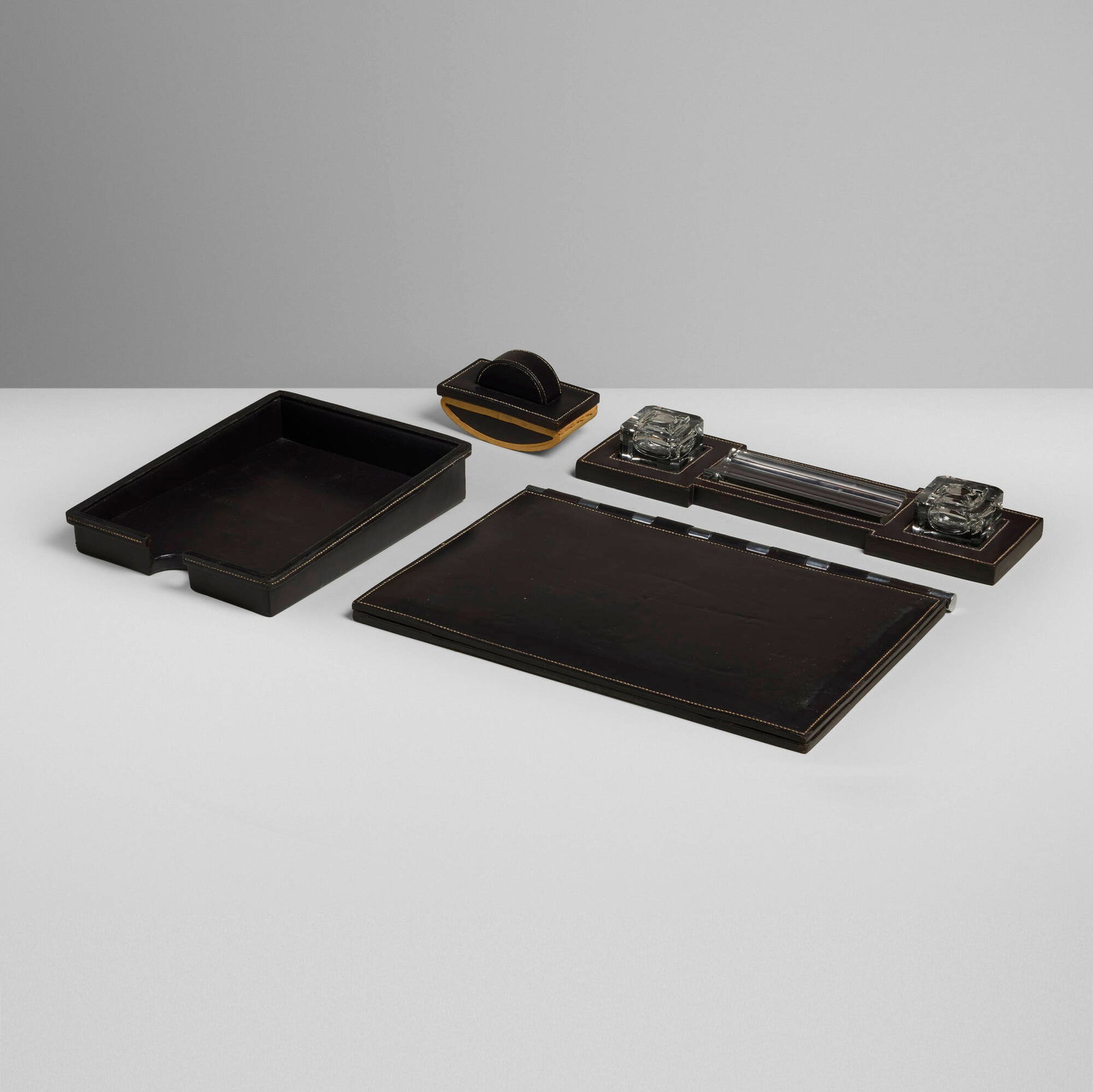 Paul Dupre-Lafon for Hermes, Desk set: Paul Dupre-Lafon for Hermes Desk set France, c. 1940 stitched leather, glass, layered paper, silver-plated brass largest: 0.75 h x 27.625 w x 19.625 d in (2 x 70 x 50 cm) smallest: 3.875 h x 6.625 w