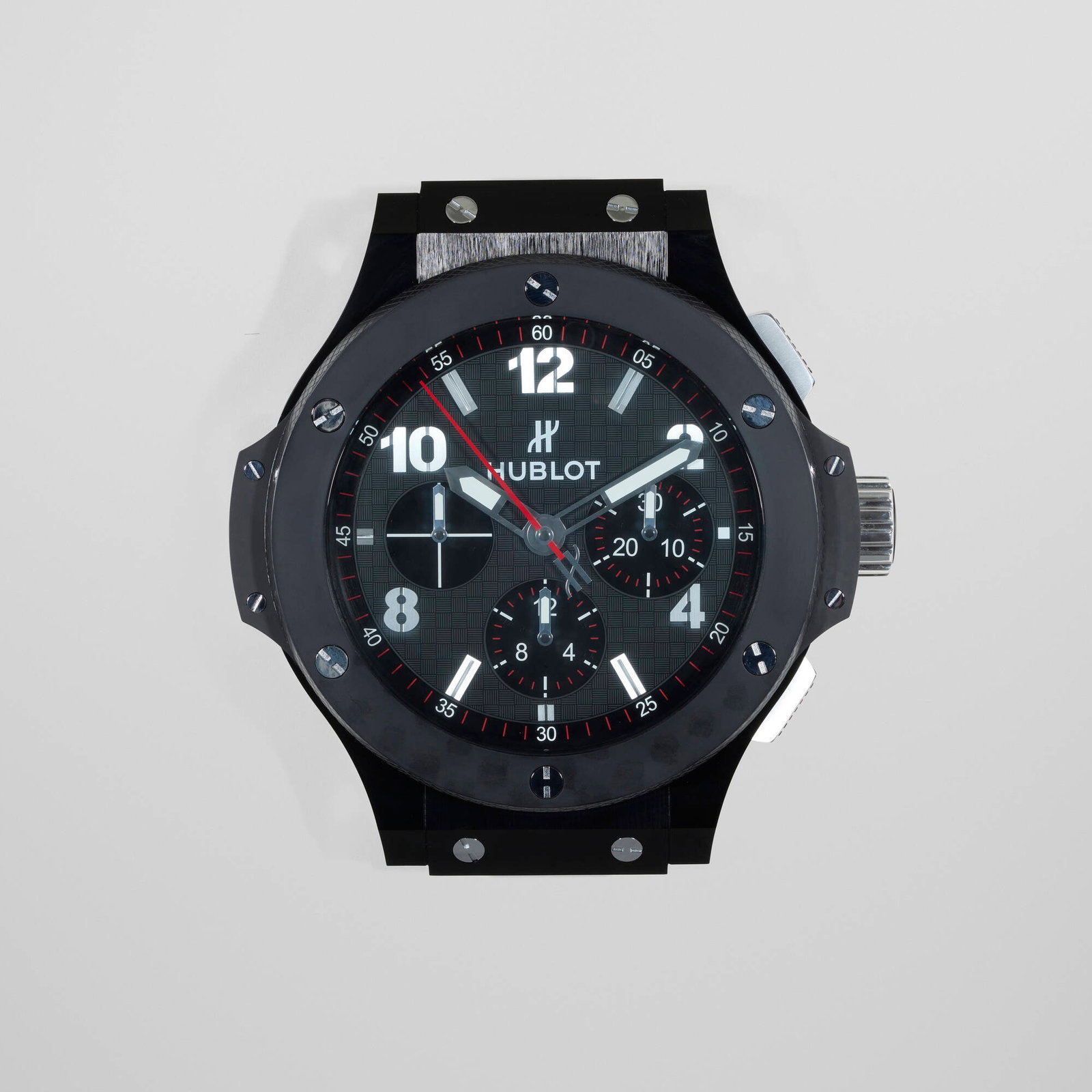Hublot, Big Bang retailer display wall clock: Hublot Big Bang retailer display wall clock Switzerland, c. 2015 glass, metal 20 h x 19 w x 5.25 d in (51 x 48 x 13 cm) Printed manufacturer's mark to face 'Hublot'. Sold with aluminum