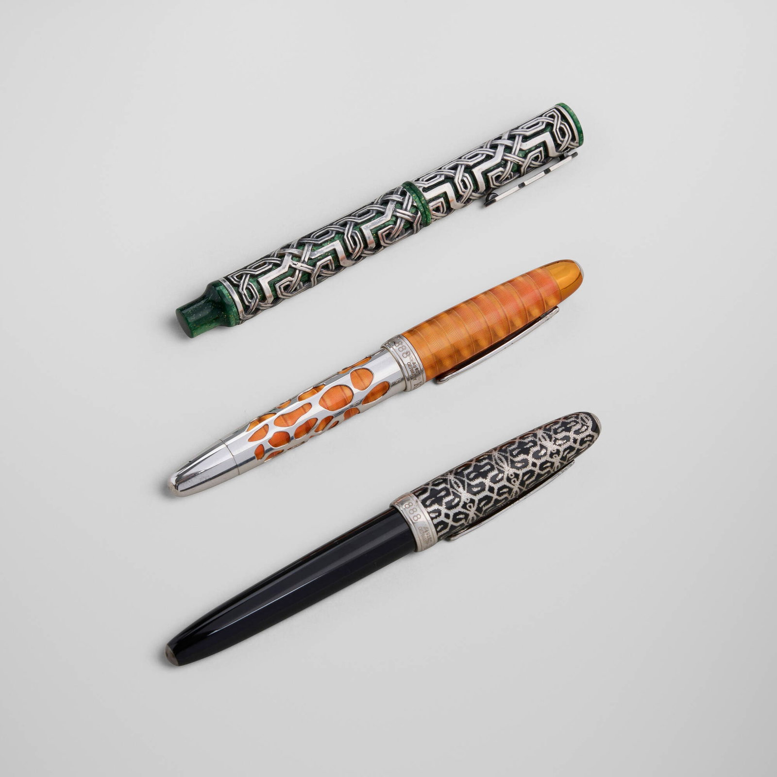 Krone, Collection of three rollerball pens: Krone Collection of three rollerball pens USA, 21st century lacquer, resin, sterling silver 5.75 h x 0.75 dia in (15 x 2 cm) 5.75 h x 0.75 dia in (15 x 2 cm) 5.5 h x 0.75 dia in (14 x 2 cm)