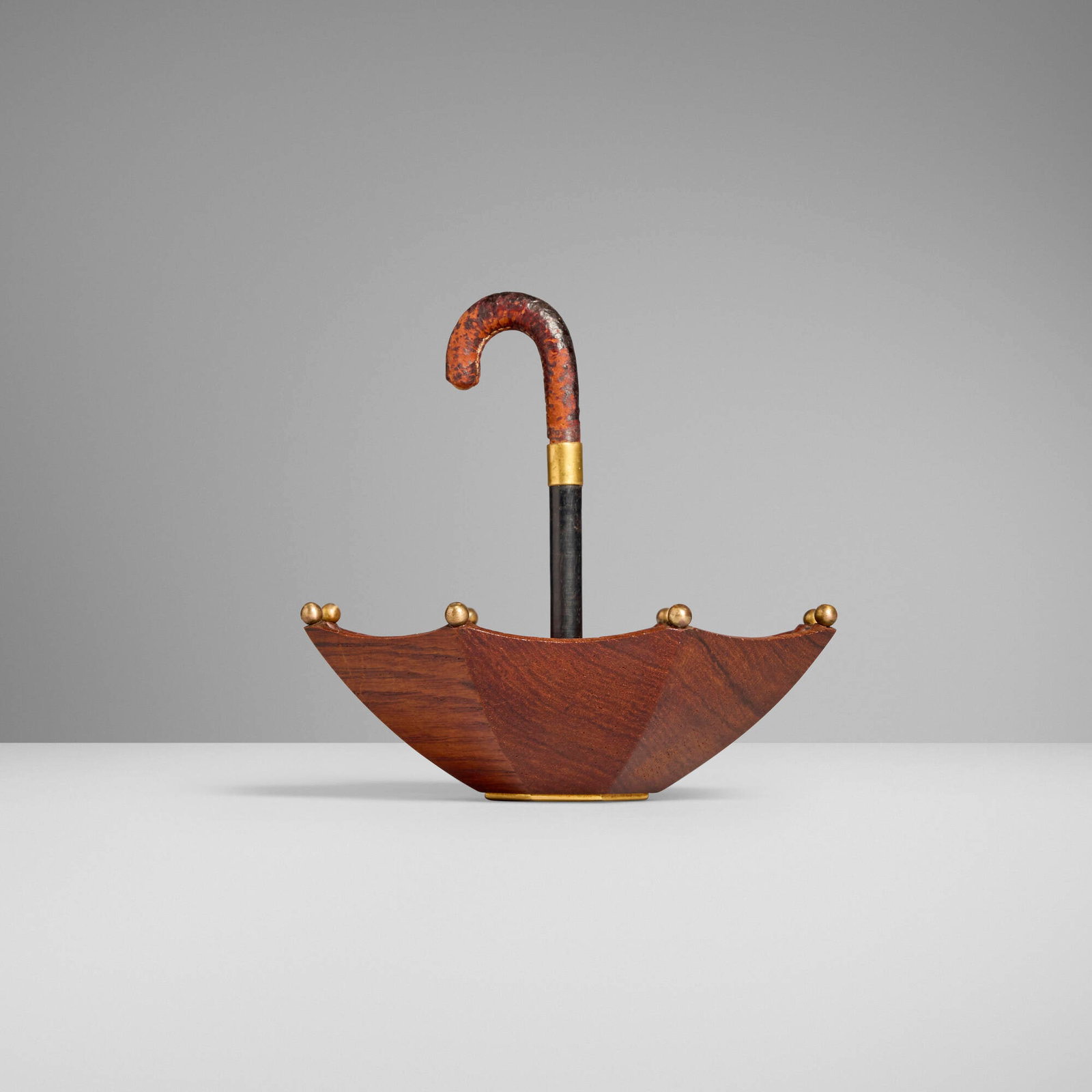 Hermes, Umbrella ring tray: Hermes Umbrella ring tray France, c. 1945 leather, brass, rosewood 5 h x 6 dia in (13 x 15 cm) Impressed manufacturer's mark to underside 'Hermes Paris' with maker's mark. This