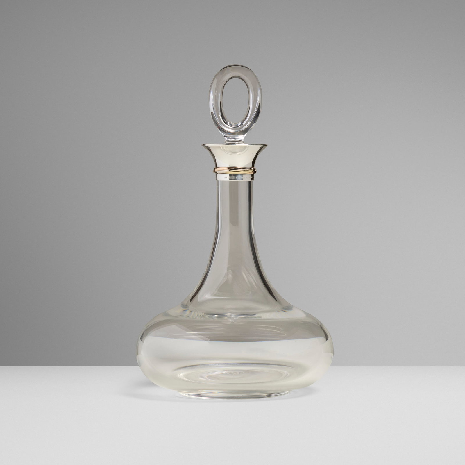 Cartier, Les Must de Cartier decanter with stopper: Cartier Les Must de Cartier decanter with stopper France, c. 1985 glass, sterling silver parcel-gilt 11.125 h x 6.75 dia in (28 x 17 cm) Impressed manufacturer's mark and number to silver