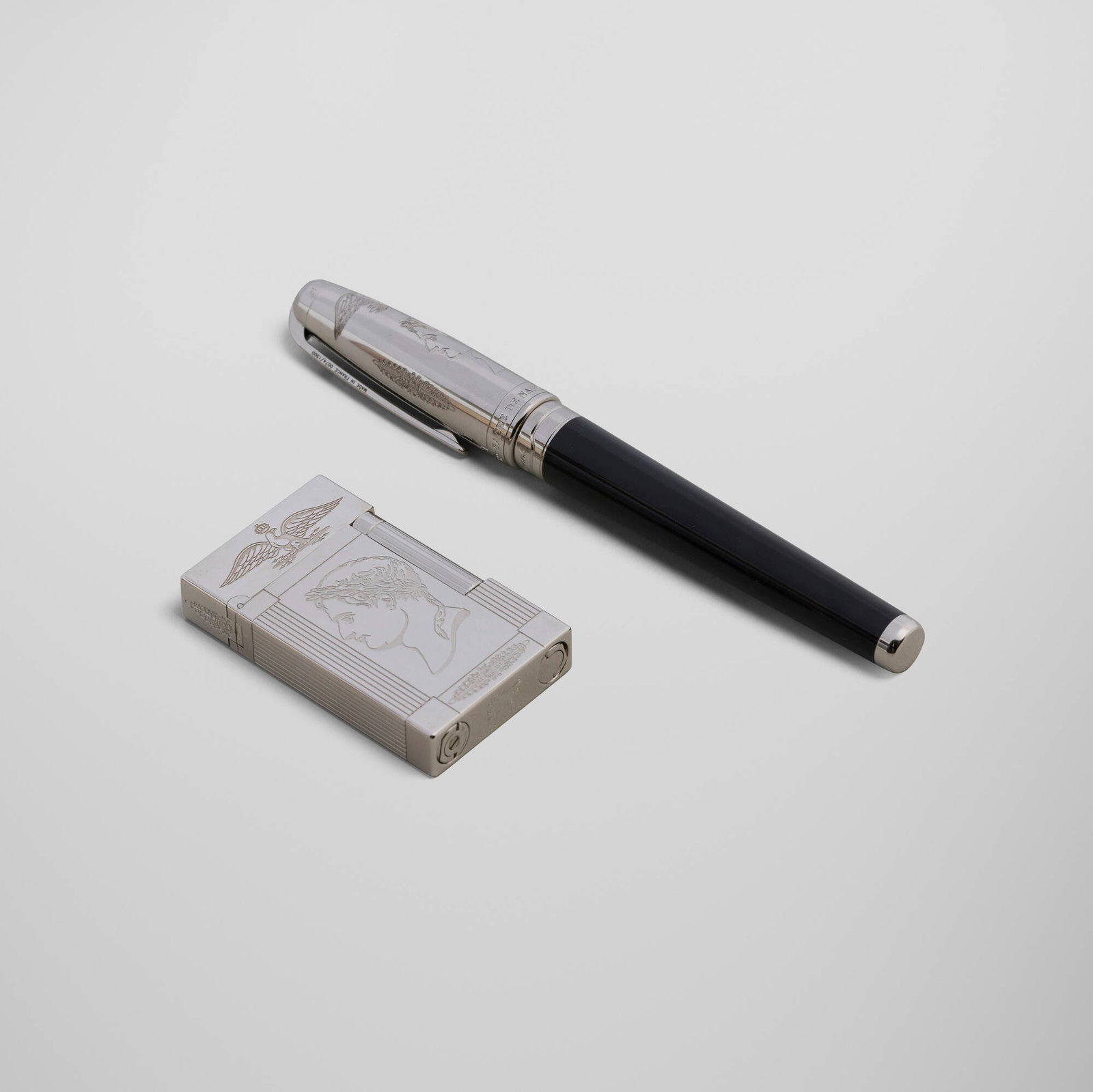 S.T. Dupont, Napoleon Bonaparte pocket lighter and fountain pen set: S.T. Dupont Napoleon Bonaparte pocket lighter and fountain pen set France, 2003 lacquer, palladium-plated metal, 18k gold nib 5.75 h x 0.75 dia in (15 x 2 cm) 2.5 h x 1.5 w x 0.5 d in (6 x 4 x 1 cm)