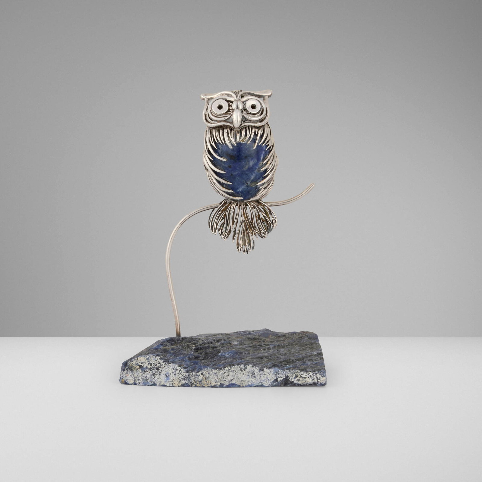 Lalaounis, Untitled (Owl sculpture): Lalaounis Untitled (Owl sculpture) Greece, c. 1975 .800 silver, sodalite 6.5 h x 5.5 w x 3.5 d in (17 x 14 x 9 cm) Impressed maker's mark to reverse of owl 'Greece A21 800' with