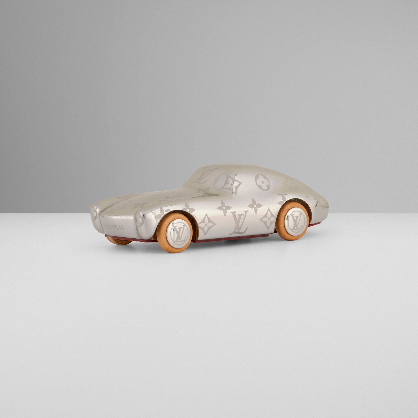 Louis Vuitton, Voguez, Volez, Voyagez car paperweight: Louis Vuitton Voguez, Volez, Voyagez car paperweight France / Italy, 2019 metal, leather 1.875 h x 6.375 w x 2.625 d in (5 x 16 x 7 cm) Impressed manufacturer's mark to underside '? Louis