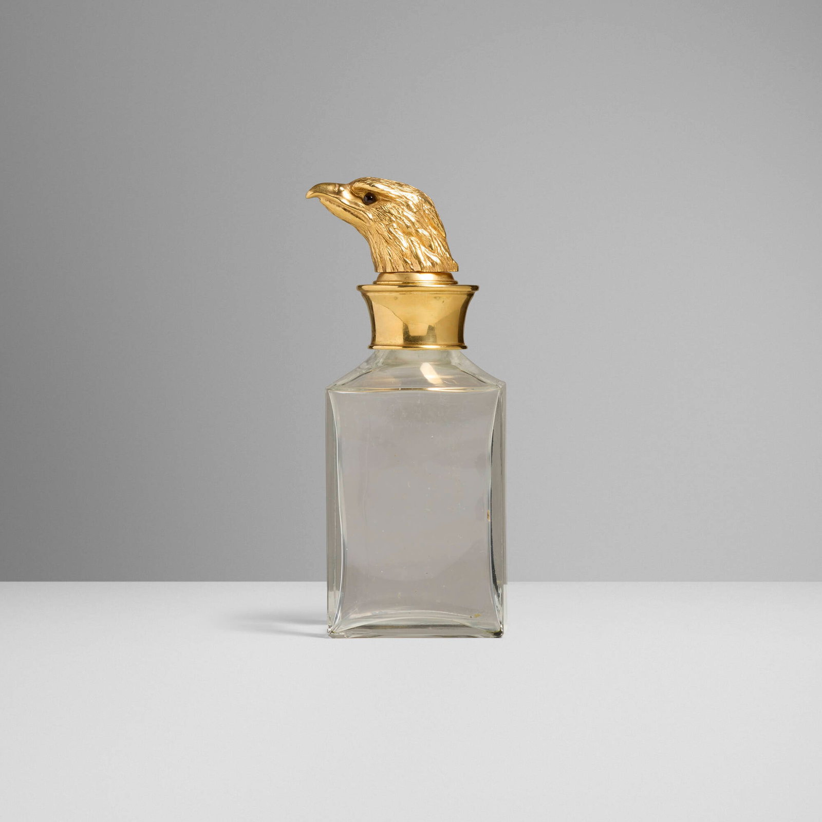 Christian Dior, Decanter with eagle head stopper: Christian Dior Decanter with eagle head stopper France/Italy, c. 1965 gilt brass, glass 10.125 h x 3.875 w x 4.375 d in (26 x 10 x 11 cm) Impressed manufacturer's mark to underside of stopper