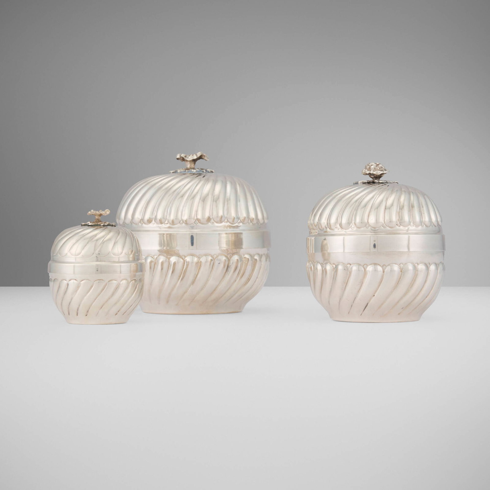 Continental, Lidded jars, set of three: Continental Lidded jars, set of three 20th century .900 silver 4.75 h x 4.5 dia in (12 x 11 cm) 4.25 h x 3.75 dia in (11 x 10 cm) 3.25 h x 2.5 dia in (8 x 6 cm) Impressed to underside of two examples