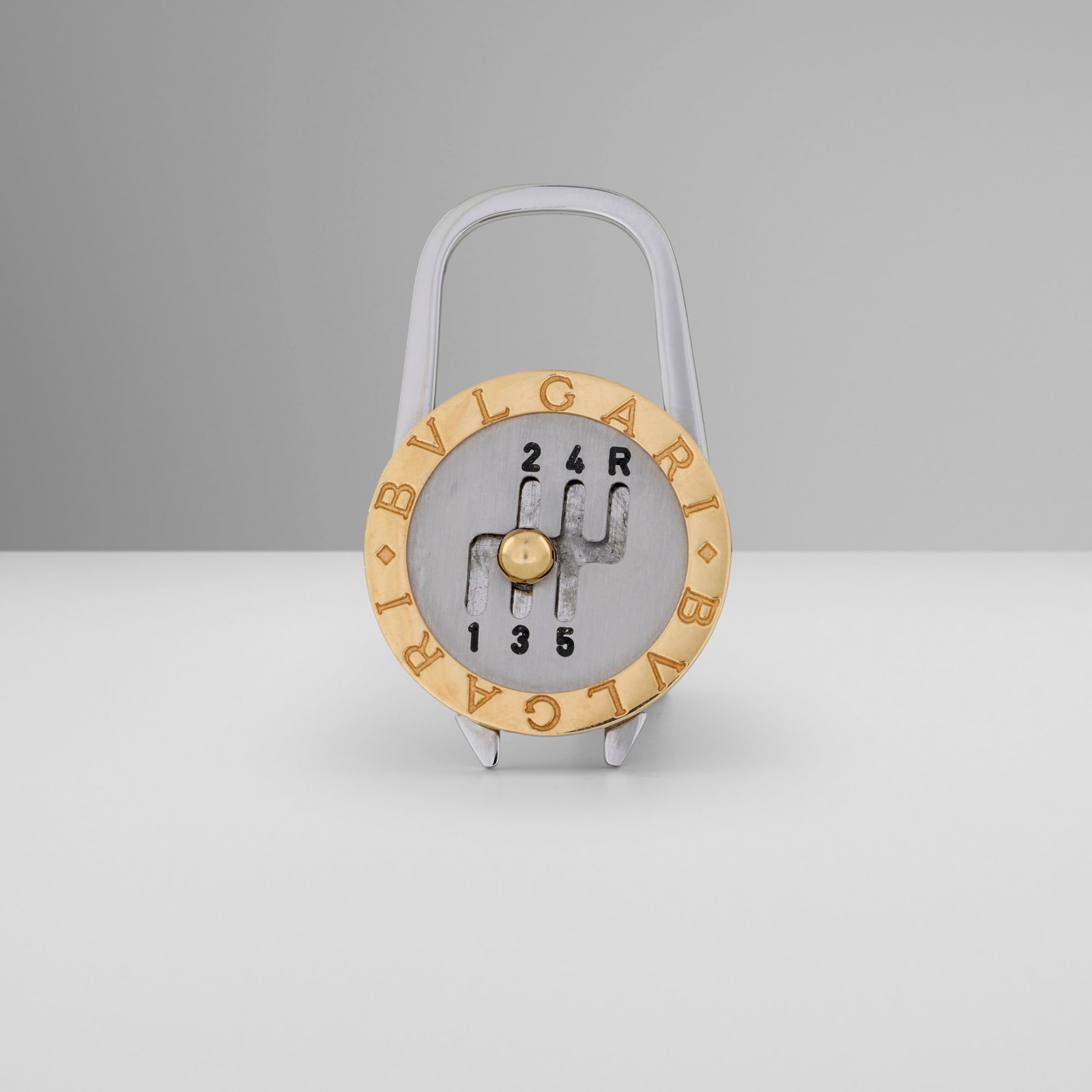 Bulgari, Rare Ferrari movable gated shifter keyring: Bulgari Rare Ferrari movable gated shifter keyring Italy, c. 1990 yellow gold, stainless steel 2 h x 1.25 w x 0.25 d in (5 x 3 x 1 cm) Impressed manufacturer's mark to face 'Bulgari'