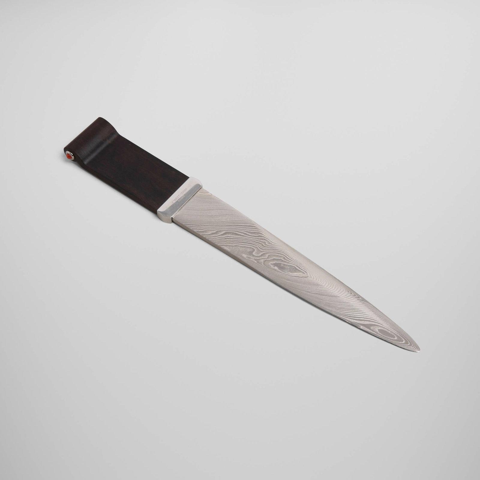 Cartier, Letter opener: Cartier Letter opener France, late 20th century Damascus steel, grenadilla wood, coral 1.125 h x 0.5 w x 7.75 l in (3 x 1 x 20 cm) Impressed manufacturer's mark and number to handle
