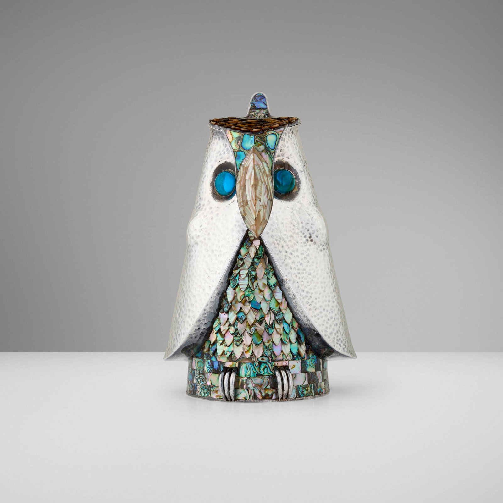 Los Castillo, Owl-form covered pitcher: Los Castillo Owl-form covered pitcher Mexico, c. 1960 silver-plated metal, abalone shell, mother-of-pearl, glass 10.25 h x 6.5 w x 6 d in (26 x 17 x 15 cm) Impressed manufacturer's mark to
