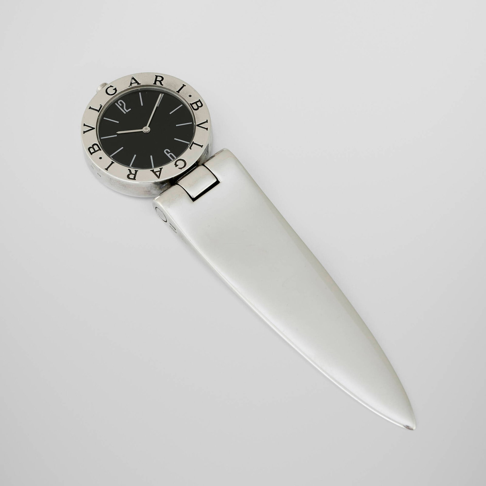 Bulgari, Timepiece with letter opener: Bulgari Timepiece with letter opener Italy, c. 2000 sterling silver 5.5 h x 1.25 w x 0.25 d in (14 x 3 x 1 cm) Impressed manufacturer's mark to face and edge '925 Bulgari'. 4.94 ozt.