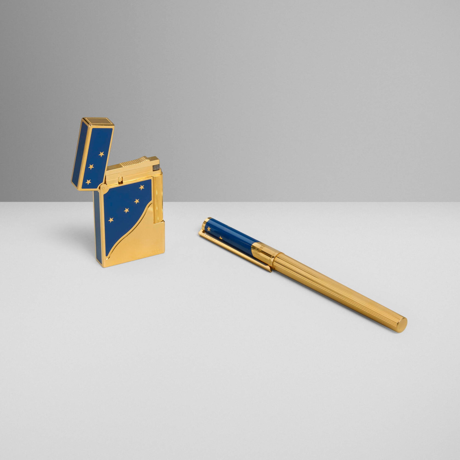 S.T. Dupont, Europa pocket lighter and fountain pen set: S.T. Dupont Europa pocket lighter and fountain pen set France, 1993 lacquer, gold-plated metal, 18k gold nib 5.5 h x 0.375 w x 0.5 d in (14 x 1 x 1 cm) 2.5 h x 1.5 w x 0.375 d in (6 x 4 x 1 cm)