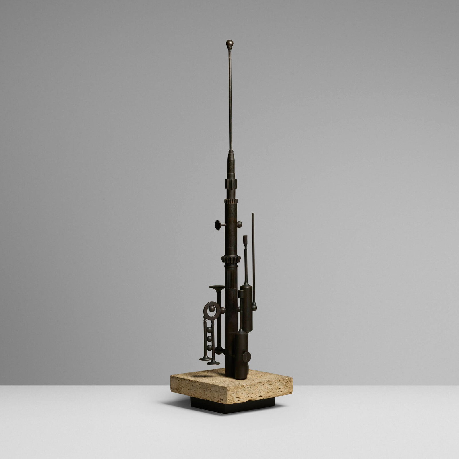 Italian, Sculpture: Italian Sculpture second half of the 20th century patinated bronze, travertine 34.5 h x 8.5 w x 8 d in (88 x 22 x 20 cm) Impressed mark to lower reverse 'Made in Italy'. This work will ship