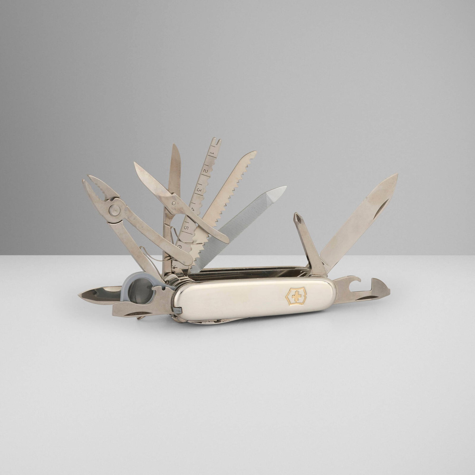 Tiffany & Co., Swiss pocket knife: Tiffany & Co. Swiss pocket knife New York, USA, c. 1995 stainless steel, sterling silver, 18k yellow gold 3.75 h x 1 w x 1.25 d in (10 x 3 x 3 cm) Impressed manufacturer's mark to one end