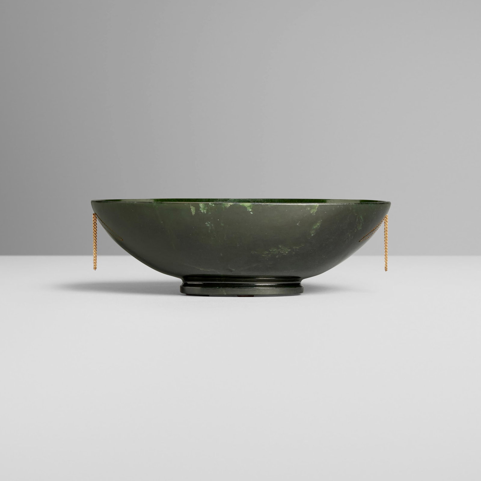 Chinese, Bowl with chain handles: Chinese Bowl with chain handles 20th century spinach jade, gold-plated metal, gemstones 2.125 h x 6.625 w x 4.375 d in (5 x 17 x 11 cm) This work will ship from Los Angeles, California.