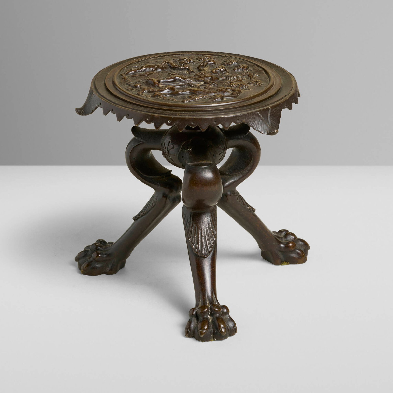 Grand Tour, Miniature tripod stand (after the antique): Grand Tour Miniature tripod stand (after the antique) second half of the 19th century patinated bronze 5 h x 5.75 dia in (13 x 15 cm) Stand features a relief of Bacchic triumph scene to top and