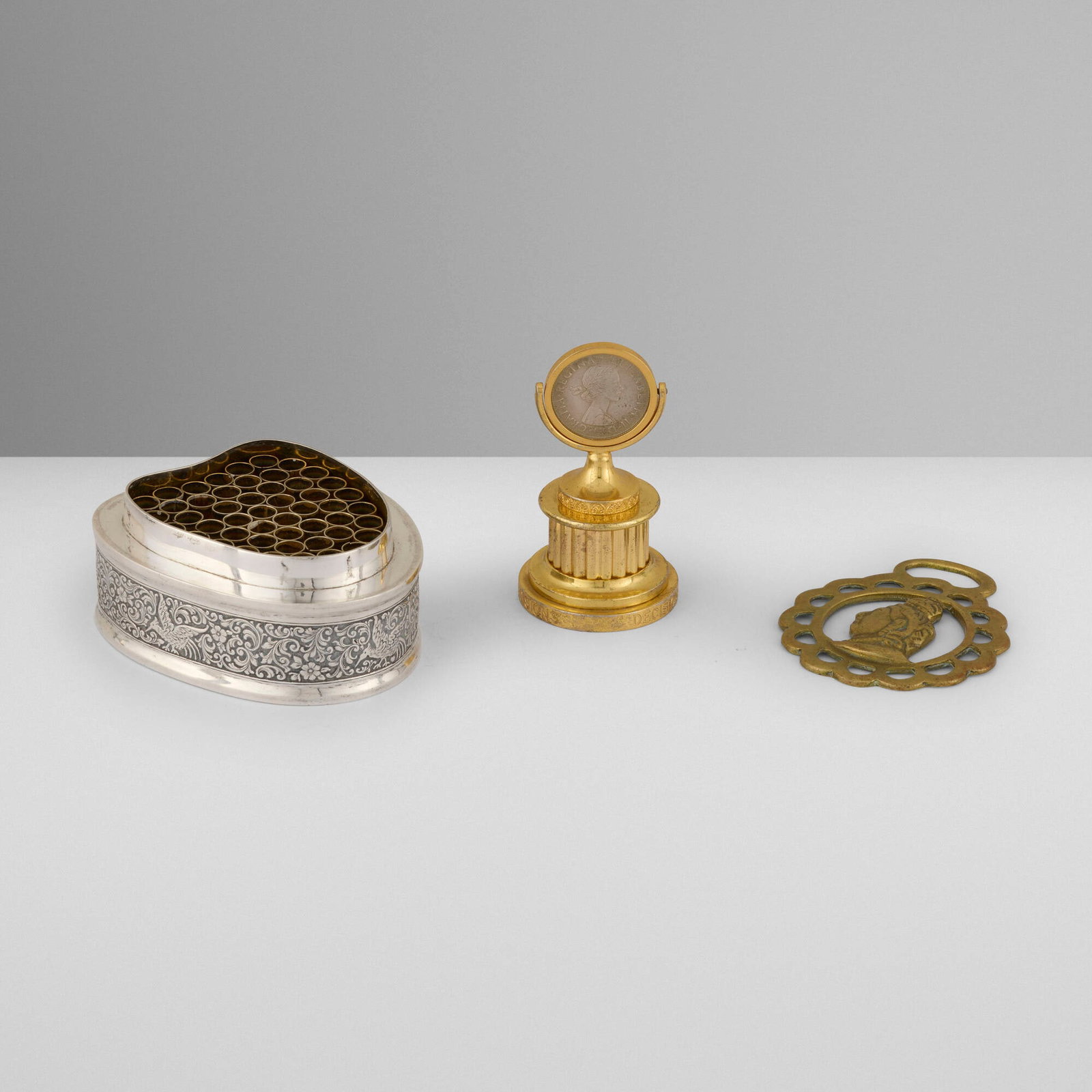 English, Collection of three works from the Estate of Duke & Duchess of Windsor: English Collection of three works from the Estate of Duke & Duchess of Windsor c. 1890, c. 1980 silver-plated metal, brass coin stand: 3.6 h x 2 dia in (9 x 5 cm) cigarette dispenser: 1.875 h x 4.1