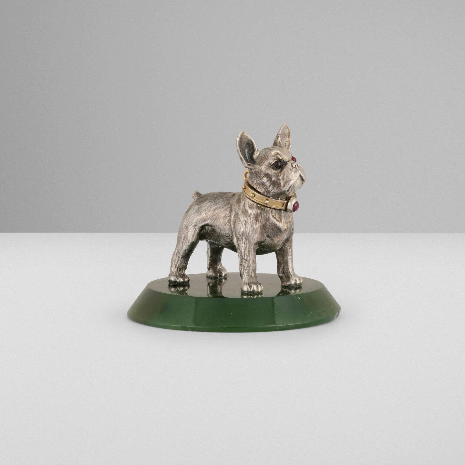 Russian, French bulldog figurine: Russian French bulldog figurine c. 1908 .916 silver parcel-gilt, nephrite jade, ruby 2 h x 2.25 dia in (5 x 6 cm) Impressed maker's marks of Faberge and Julius Alexander Rappoport with Russian