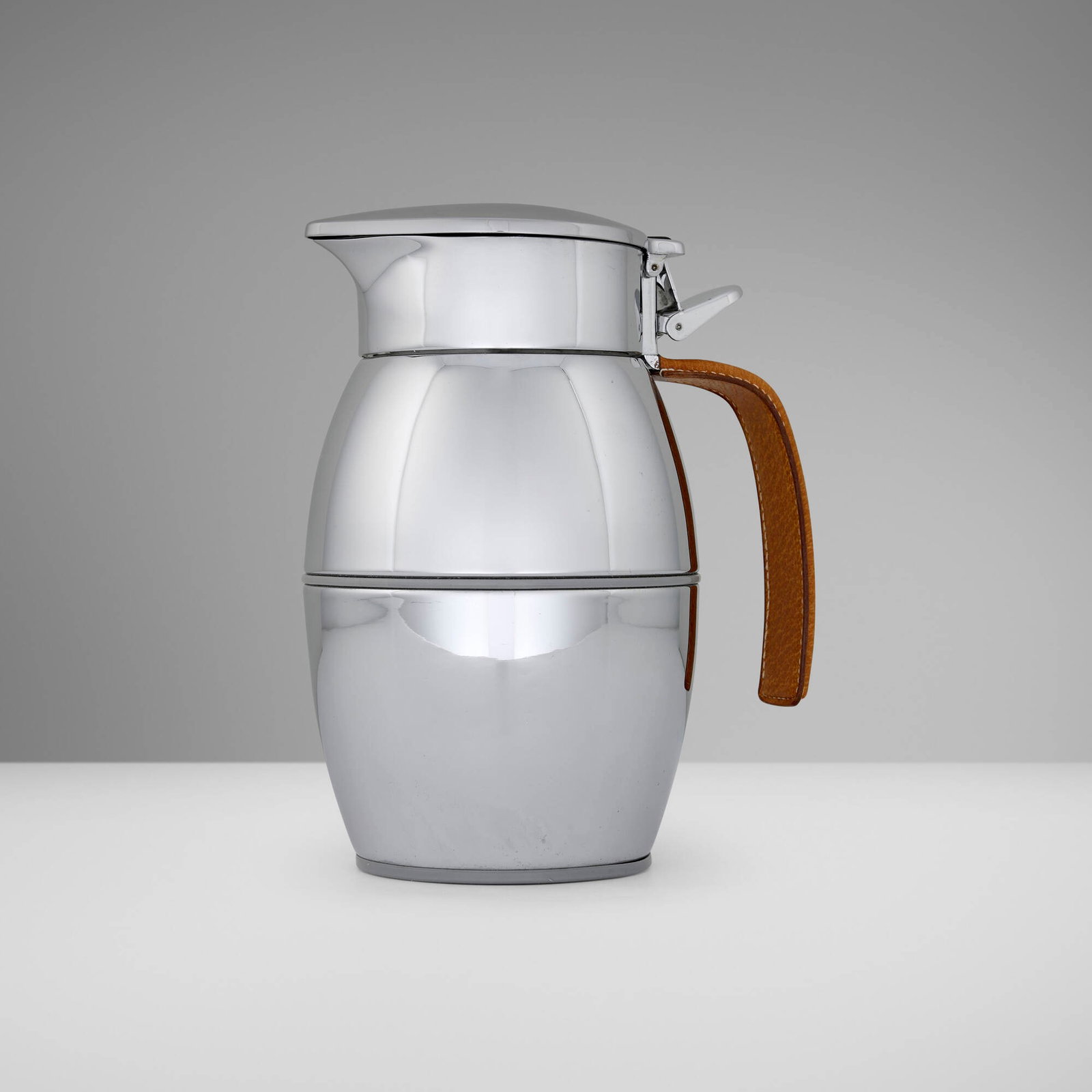 Hermes, Insulated pitcher: Hermes Insulated pitcher France, c. 1960 chrome-plated metal, leather, rubber 7.25 h x 6 w x 4 d in (18 x 15 x 10 cm) Embossed manufacturer's mark to underside leather 'Hermes Paris Made in