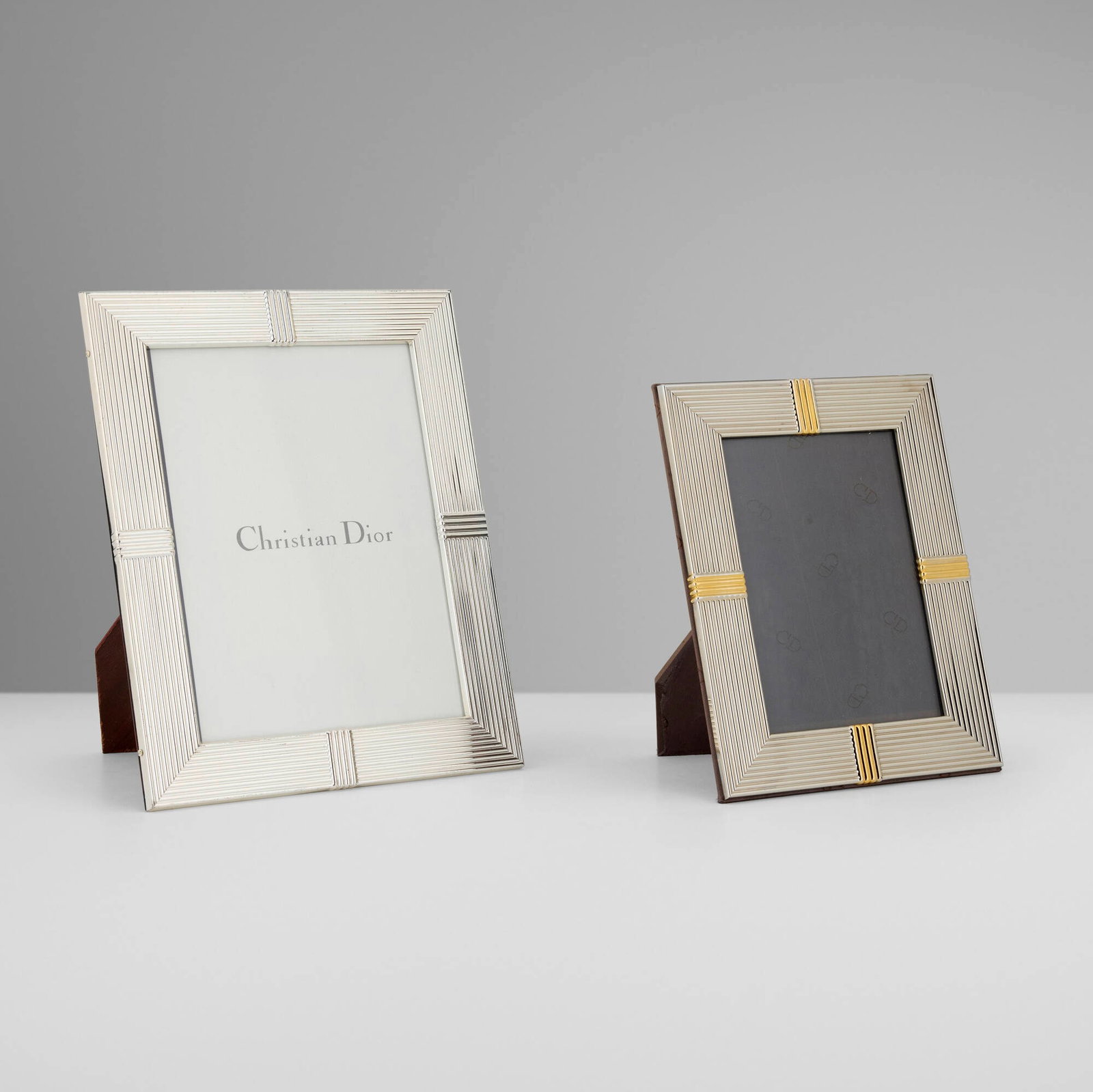Christian Dior, Picture frames, set of two: Christian Dior Picture frames, set of two France/Italy, c. 1990 silver-plated and gilt metal, wood, fabric, glass 9 h x 7 w x 0.5 d in (23 x 18 x 1 cm) 7 h x 5.5 w x 0.5 d in (18 x 14 x 1 cm)