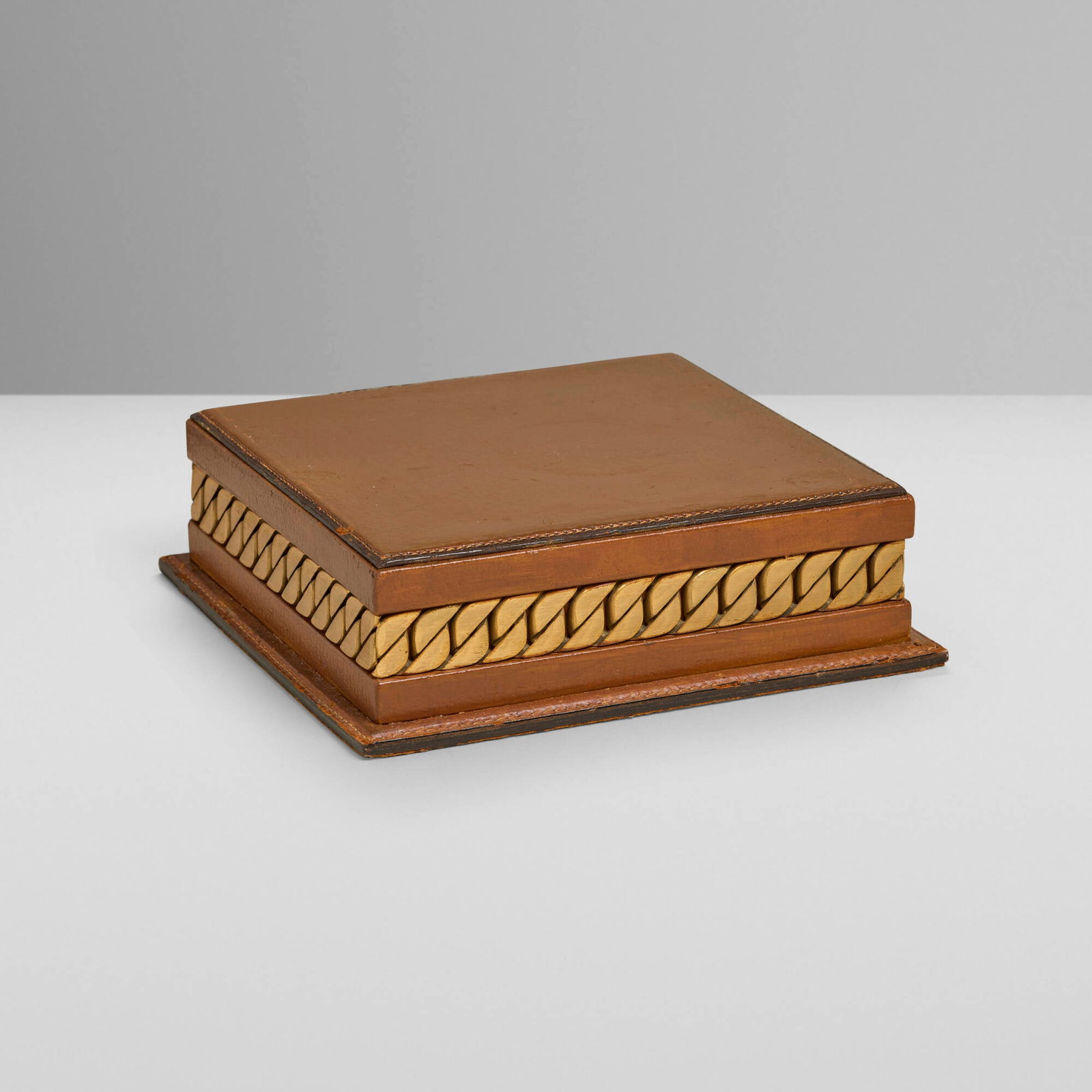 Gucci, Cigar box with chain motif: Gucci Cigar box with chain motif Italy, c. 1970 leather, gilt metal 2.5 h x 8.625 w x 8.25 d in (6 x 22 x 21 cm) Stamped manufacturer's mark to underside 'Made in Italy by Gucci'