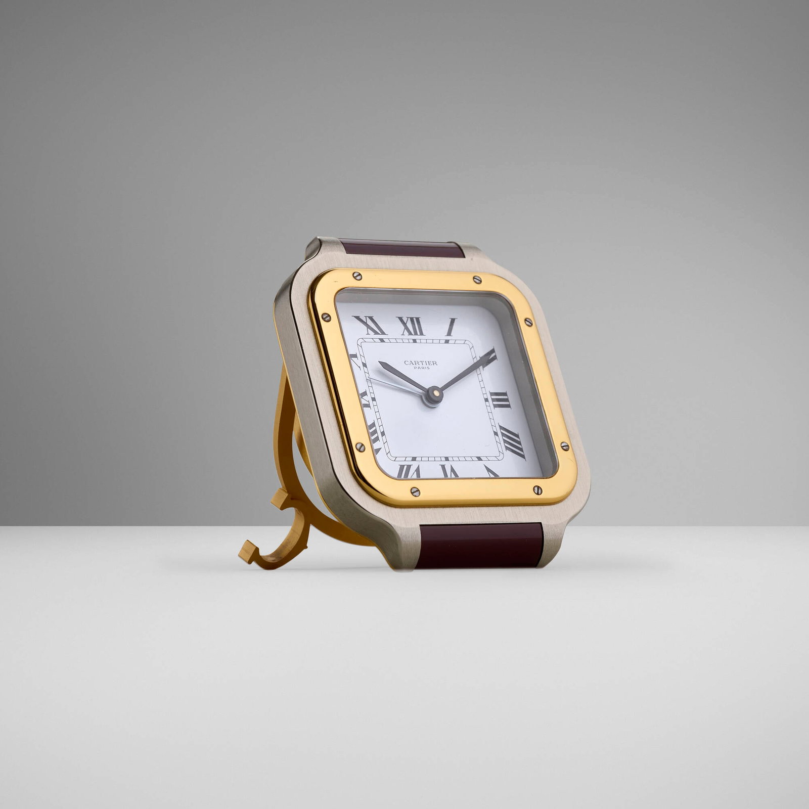 Cartier, Les Must de Cartier Santos travel alarm clock: Cartier Les Must de Cartier Santos travel alarm clock France / Switzerland, c. 1985 stainless steel, lacquered metal, gold-plated metal 3.5 h x 2.75 w x 1.25 d in (9 x 7 x 3 cm) Printed manufac