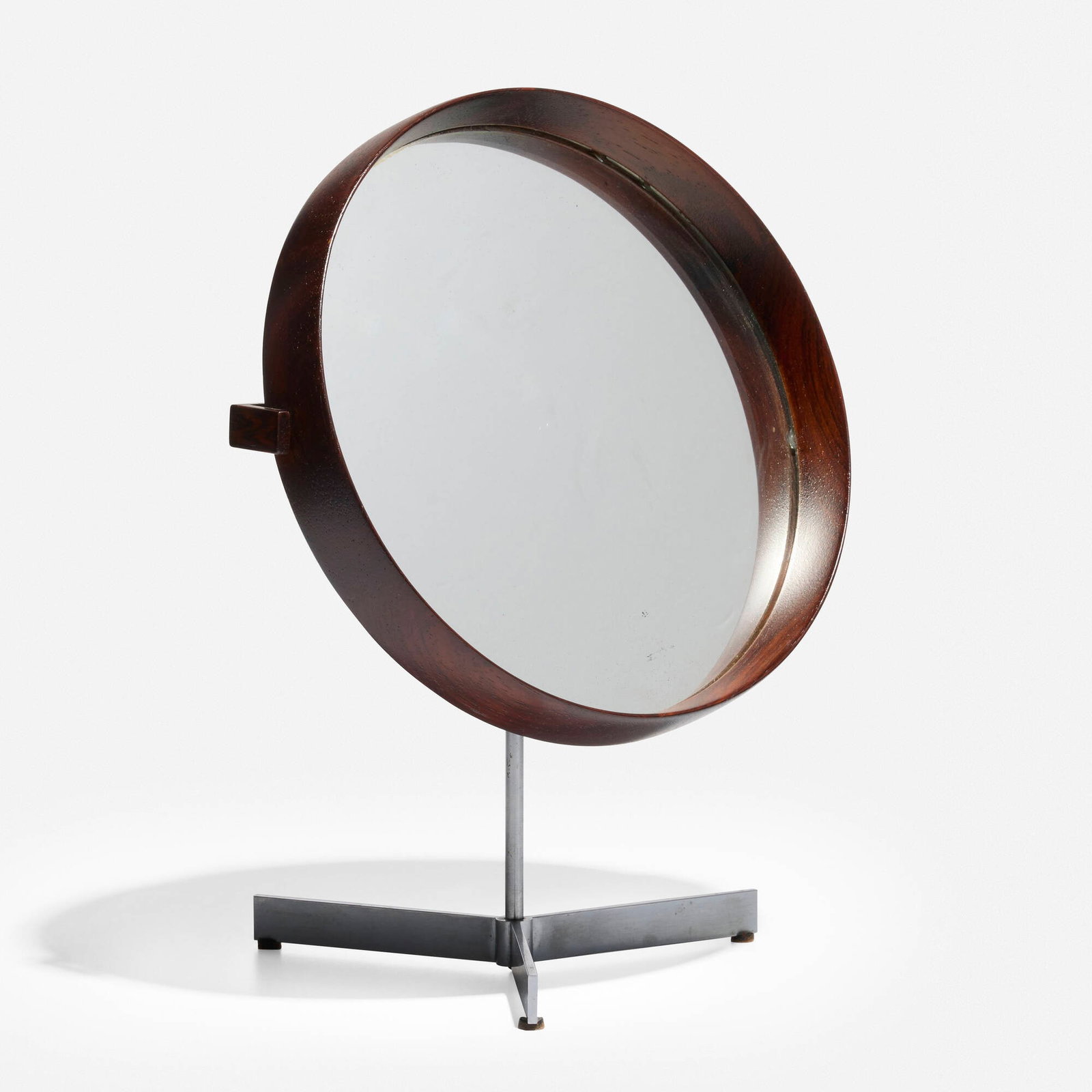 After Uno and Osten Kristiansson, Table mirror: After Uno and Osten Kristiansson Table mirror c. 1960 rosewood, mirrored glass, metal, leather 15 h x 11.625 w x 7.5 d in (38 x 30 x 19 cm) This work will ship from Lambertville, N