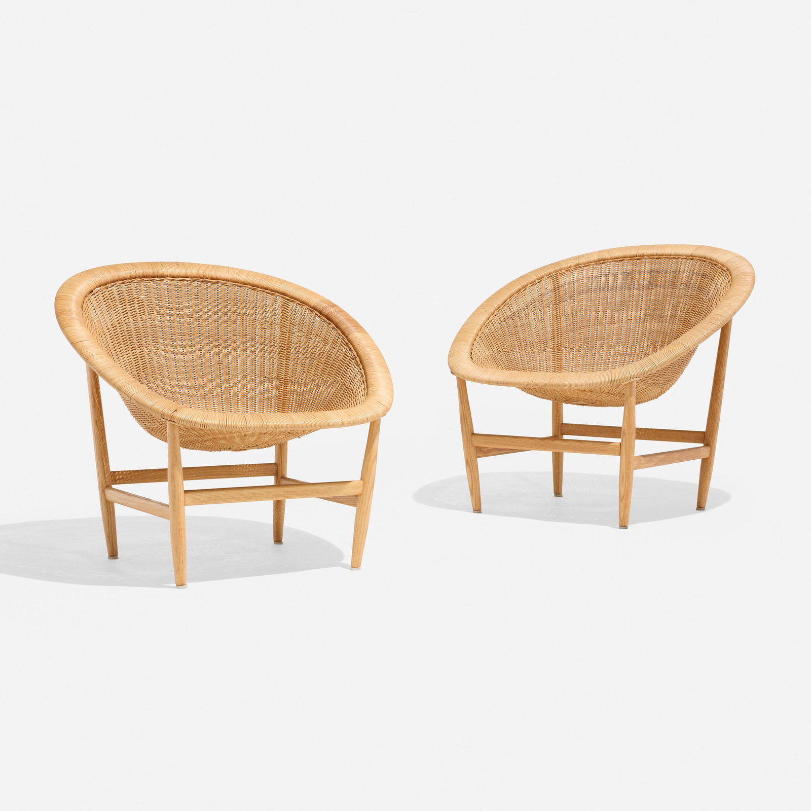 Nanna and Jorgen Ditzel, Lounge chairs, pair: Nanna and Jorgen Ditzel Lounge chairs, pair Ludvig Pontoppidan Denmark, c. 1950 rattan, ash 30 h x 32 w x 29 d in (76 x 81 x 74 cm) Examples of this design are in the permanent collection of the Art