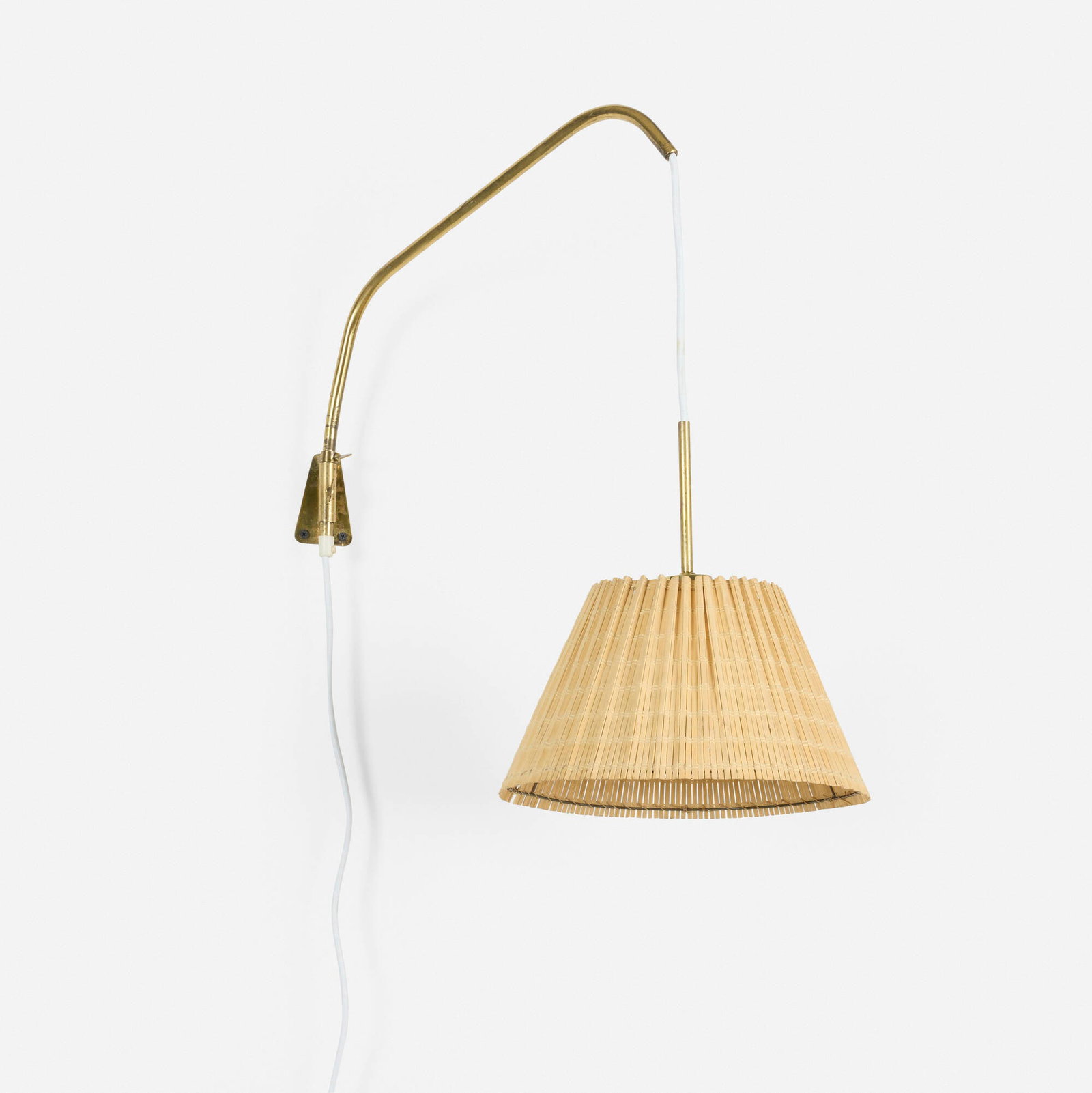 Finnish, Articulated wall lamp: Finnish Articulated wall lamp c. 1955 brass, cane shade 23 h x 12.25 w x 24 d in (58 x 31 x 61 cm) This work will ship from Chicago, Illinois.
