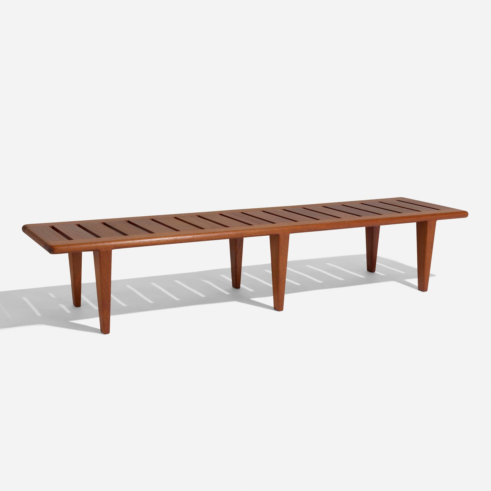 Hans J. Wegner, Bench: Hans J. Wegner Bench Johannes Hansen Denmark, c. 1960 teak 12 h x 62.875 w x 16.875 d in (30 x 160 x 43 cm) Branded manufacturer's mark to underside 'JH Johannes Hansen Copenhagen