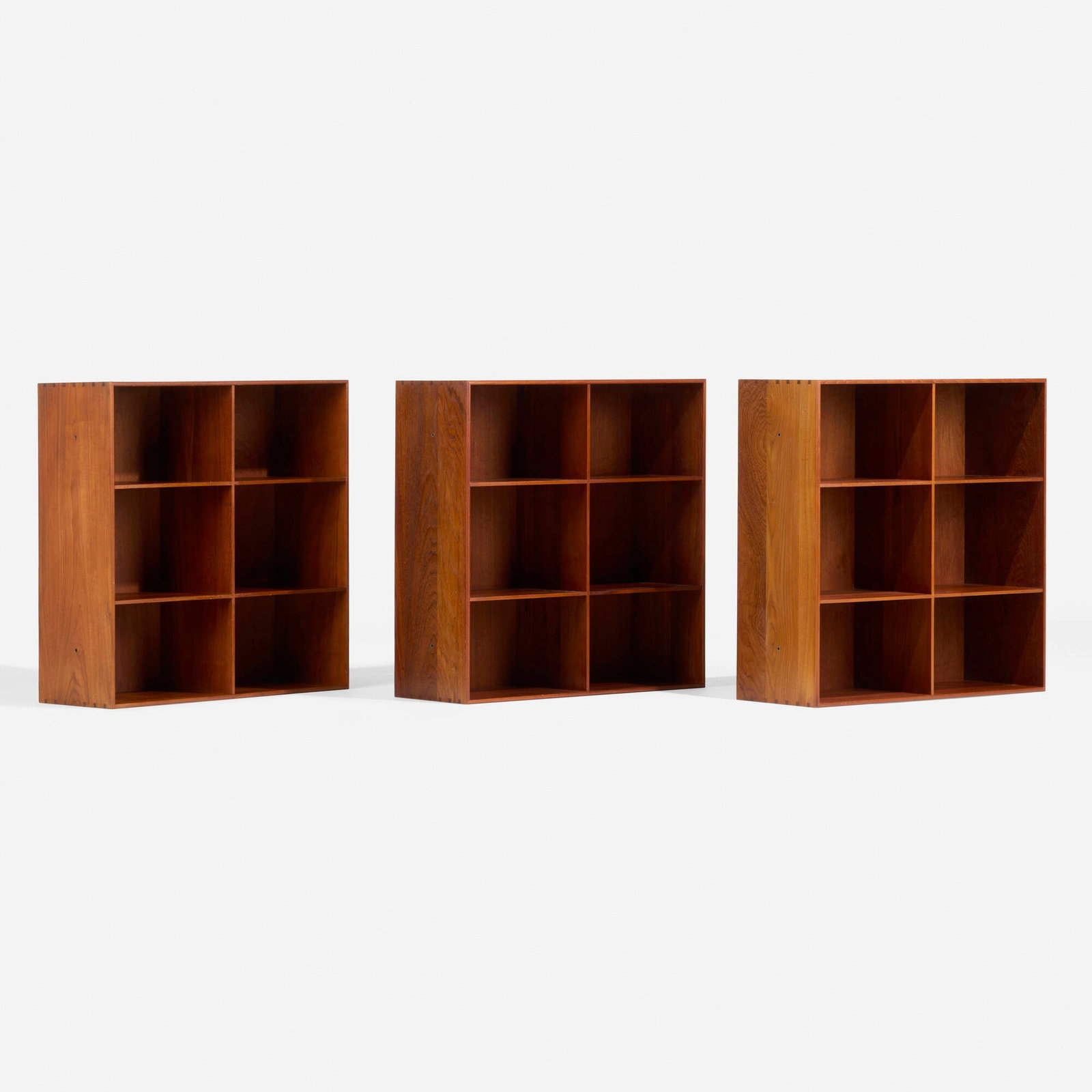 Mogens Koch, Bookcases, set of three: Mogens Koch Bookcases, set of three Rud. Rasmussens Snedkerier Denmark, c. 1960 teak, brass 30 h x 30 w x 10.75 d in (76 x 76 x 27 cm) Bookcases each feature fixed shelves. Paper manufacturer's