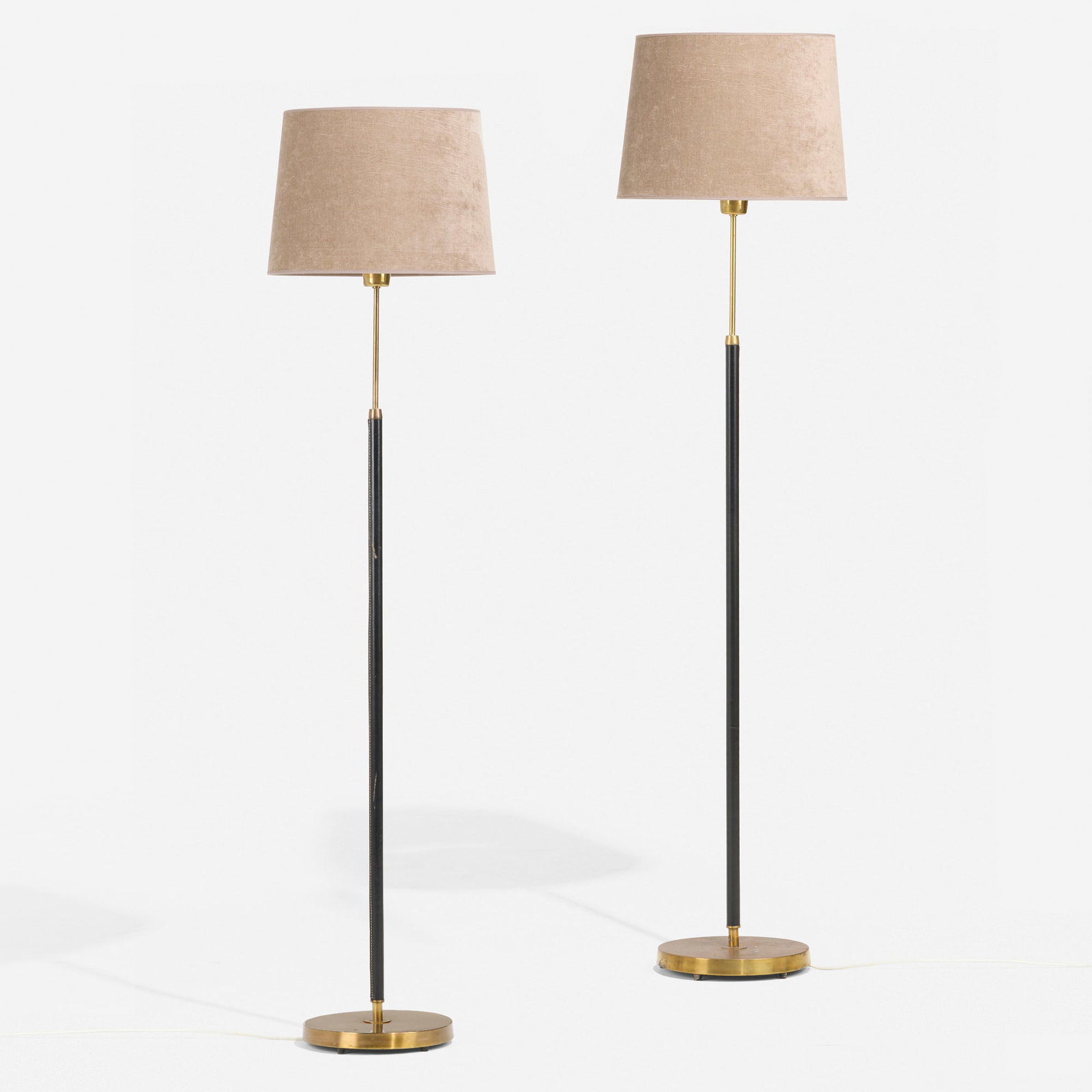 Bertil Brisborg, Floor lamps, pair: Bertil Brisborg Floor lamps, pair Falkenbergs Belysning Sweden, c. 1950 brass, saddle-stitched leather, microfiber shade 57.5 h x 13.75 dia in (146 x 35 cm) Decal manufacturer's label