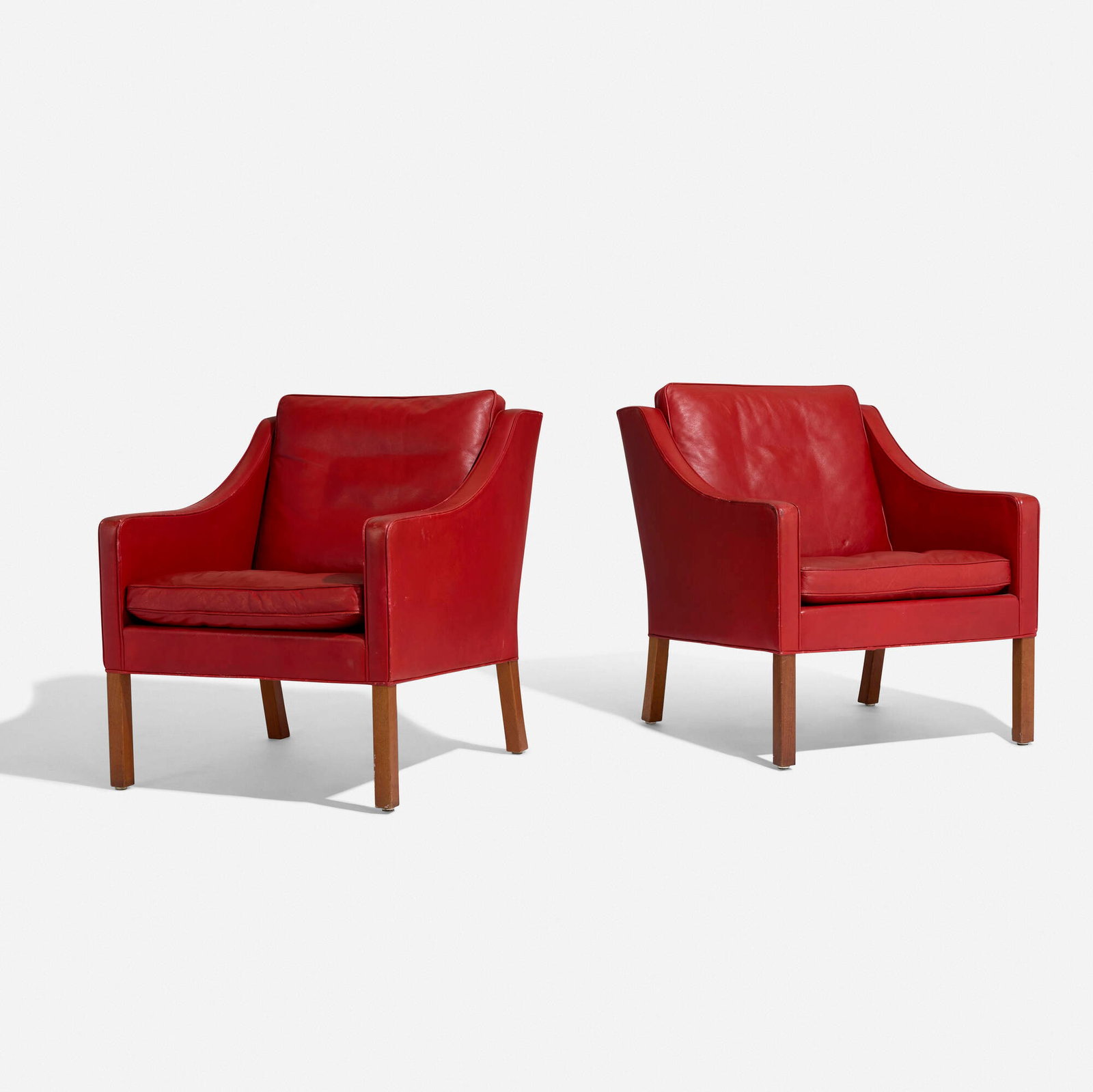 Borge Mogensen, Lounge chairs model 2207, pair: Borge Mogensen Lounge chairs model 2207, pair Fredericia Denmark, 1963 leather upholstery, teak 32.5 h x 27 w x 32 d in (83 x 69 x 81 cm) Foil manufacturer's label to underside of each example