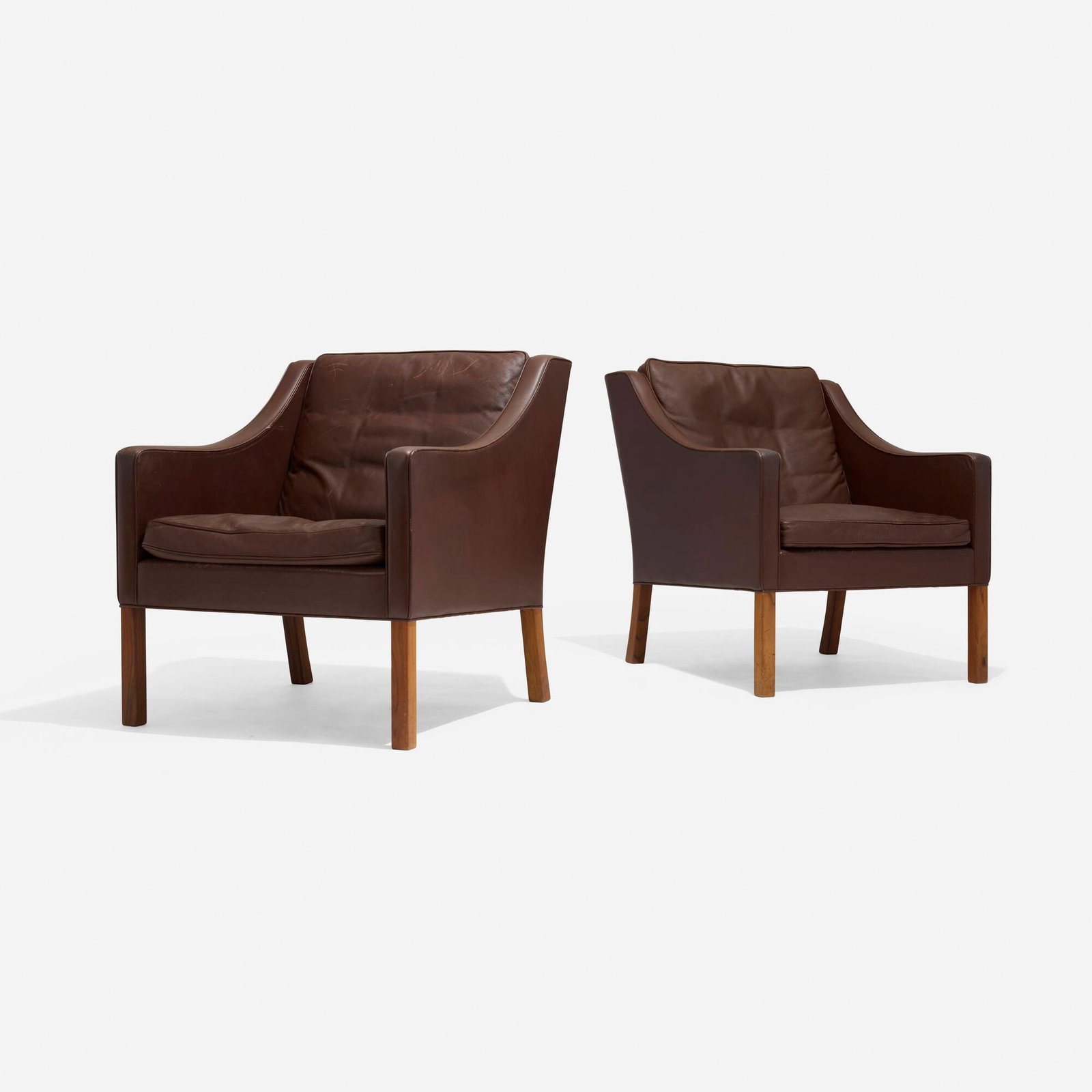 Borge Mogensen, Lounge chairs, pair: Borge Mogensen Lounge chairs, pair Fredericia Denmark, 1963 leather upholstery, rosewood 32.5 h x 27.5 w x 32 d in (83 x 70 x 81 cm) Foil manufacturer's label to underside of one example