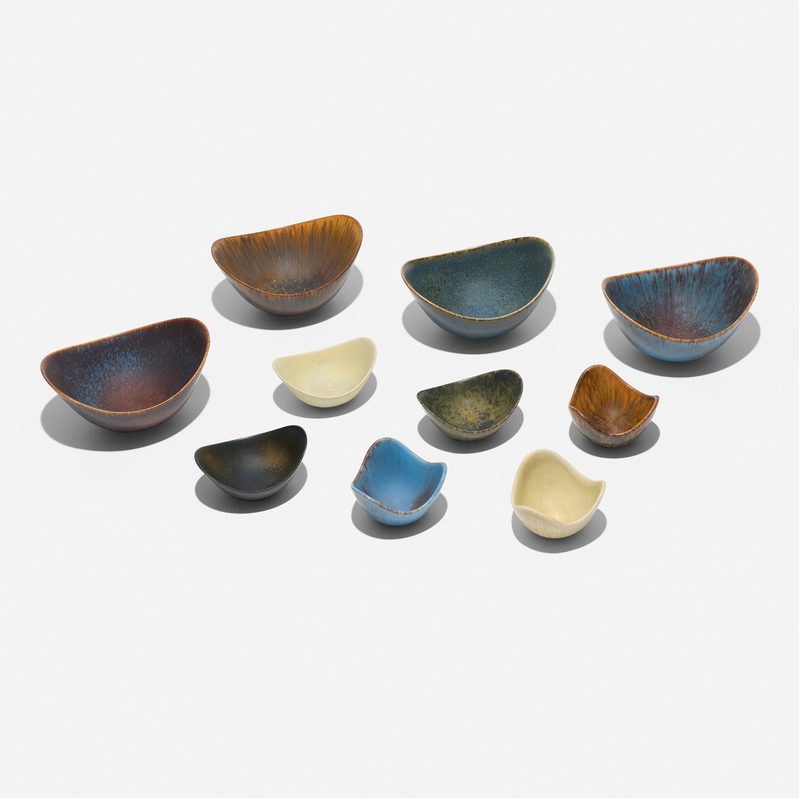 Gunnar Nylund, Collection of ten bowls: Gunnar Nylund Collection of ten bowls Rorstrand Sweden, c. 1955 glazed stoneware largest: 3.25 h x 6 w x 5 d in (8 x 15 x 13 cm) smallest: 2.25 h x 3.25 dia in (6 x 8 cm) Collection is comprised of