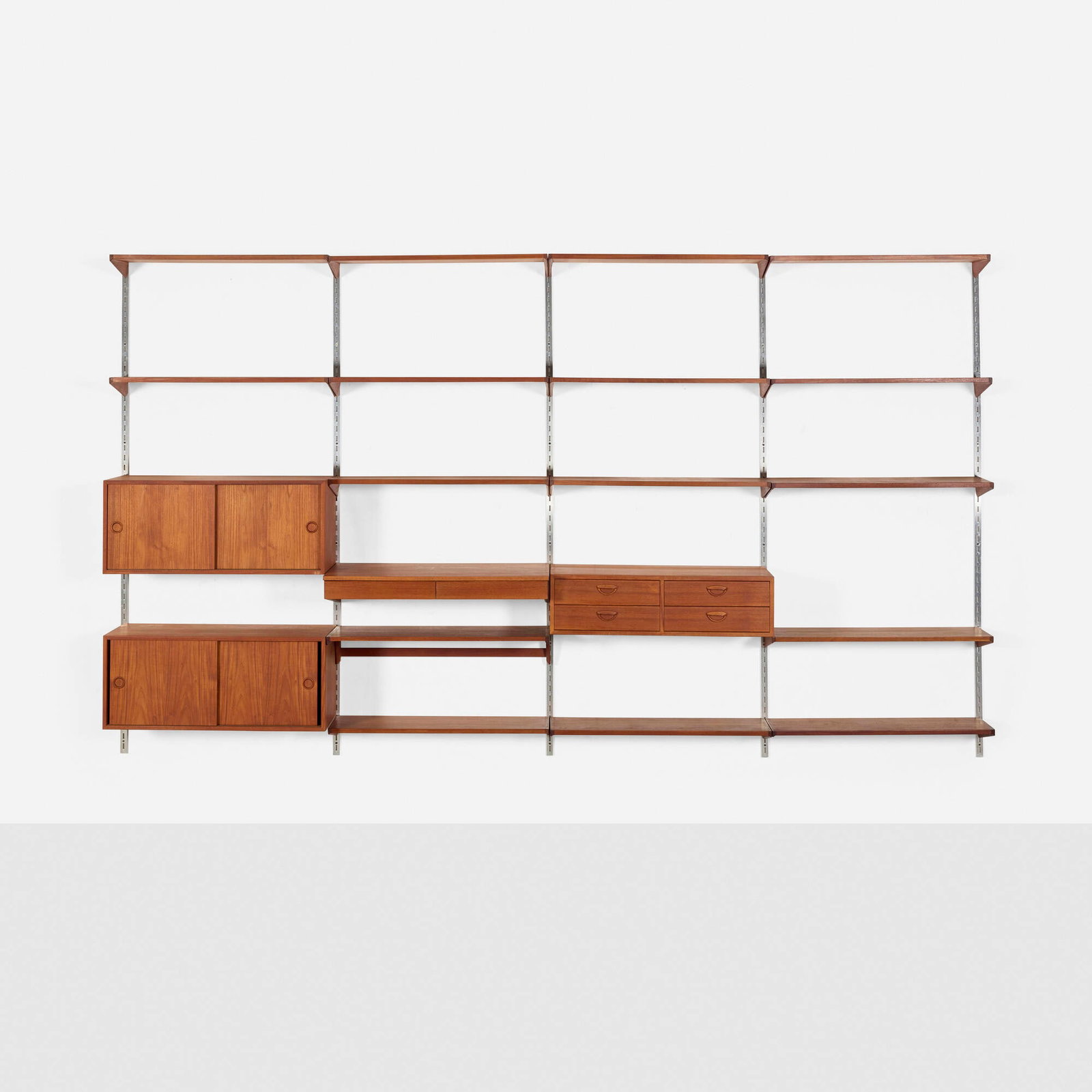 Kai Kristiansen, FM Reolsystem wall unit: Kai Kristiansen FM Reolsystem wall unit Feldballes Mobelfabrik Denmark, c. 1960 teak, aluminum 78.5 h x 135.75 w x 16.25 d in (199 x 345 x 41 cm) Wall unit features sixteen shelves, one cabinet with