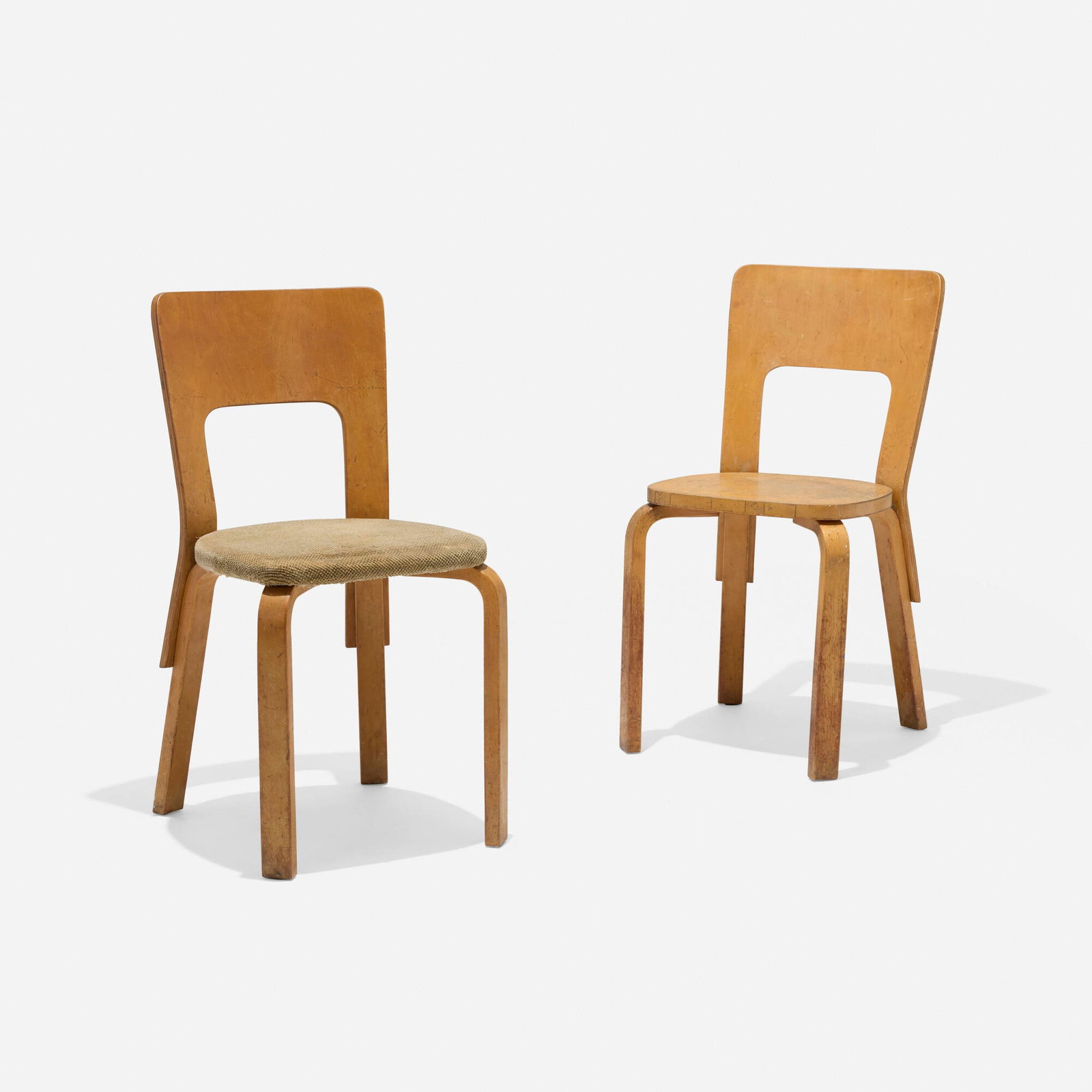 Alvar Aalto, Dining chairs model 66, pair: Alvar Aalto Dining chairs model 66, pair Artek Finland, c. 1932 birch plywood, laminated birch, upholstery 31.25 h x 15 w x 18.5 d in (79 x 38 x 47 cm) Provenance: Collection of architect Walter