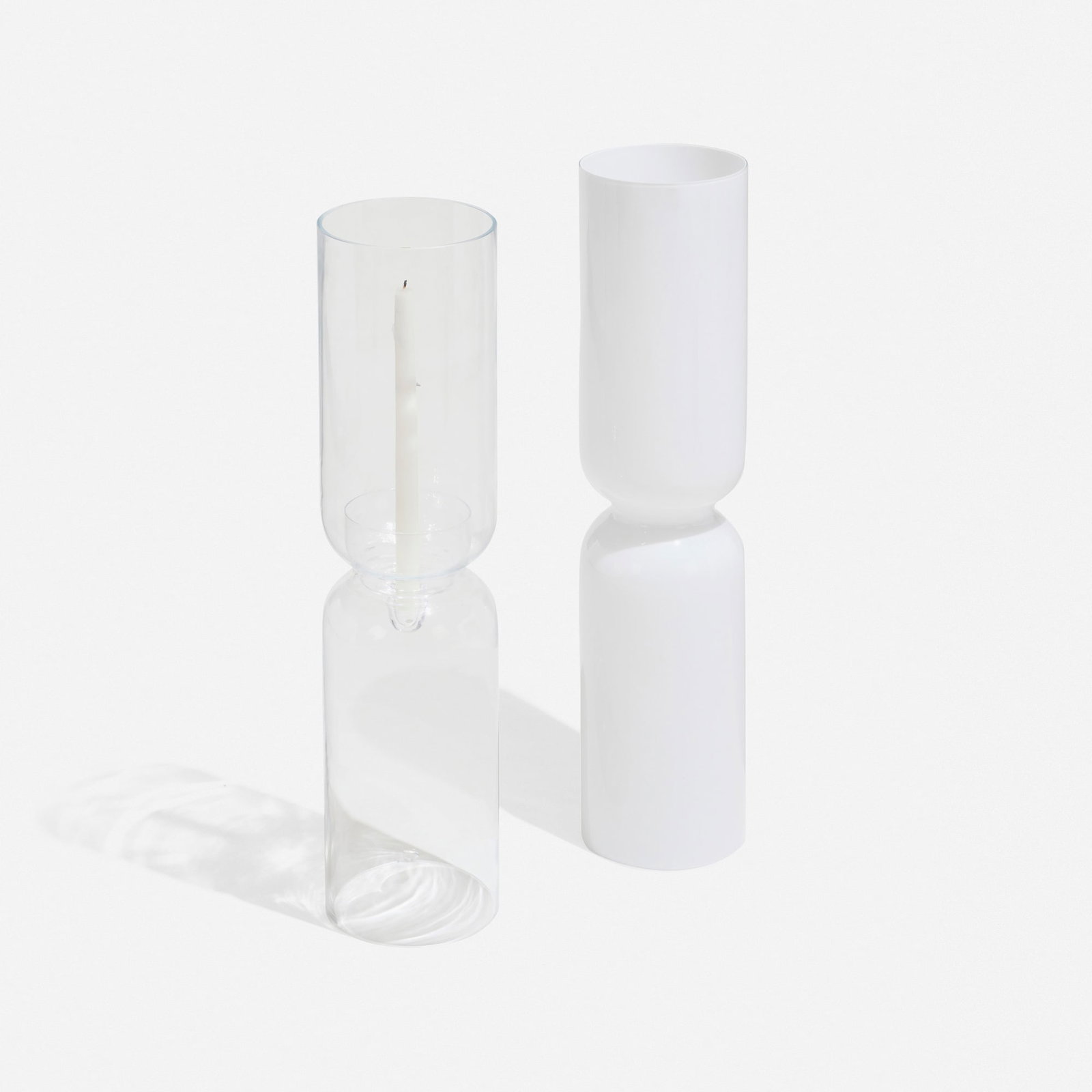 Harri Koskinen, Lantern candleholders, set of two: Harri Koskinen Lantern candleholders, set of two Iittala 1999 mouthblown glass 4 h x 4 d in (10 x 10 cm) Decal manufacturer's label to rim of each example 'iittala'. Sold with a snuffer and