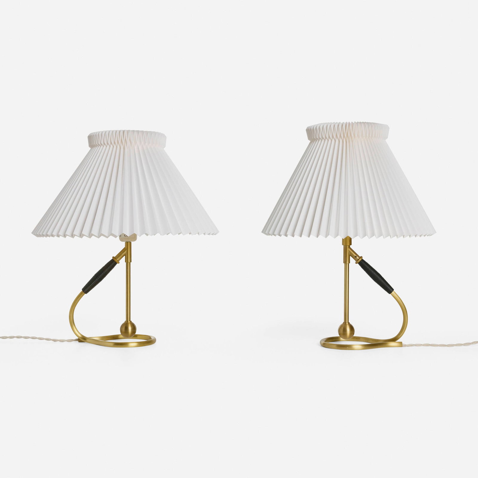 Kaare Klint, Tilting lamps model 306, pair: Kaare Klint Tilting lamps model 306, pair Le Klint Lampeskaerme Denmark, c. 1940 / recent production brass, paper shades, plastic 17.25 h x 13.75 dia in (44 x 35 cm) The stands on these tilting lamps