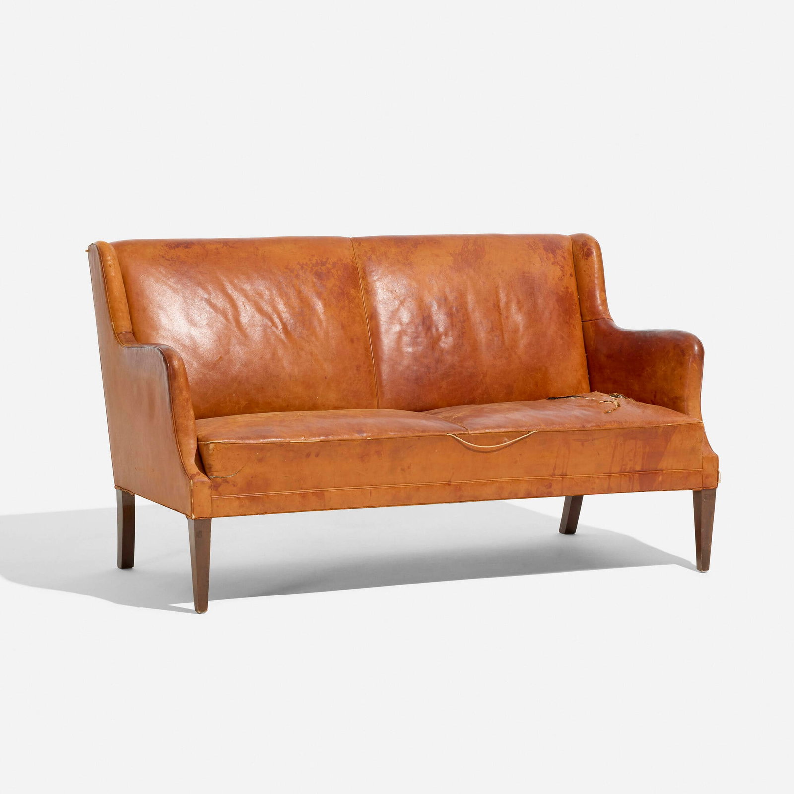 Kaare Klint, attribution, Settee: Kaare Klint, attribution Settee c. 1930 leather, mahogany 32.5 h x 55 w x 32 d in (83 x 140 x 81 cm) Provenance: Galerie Half, Los Angeles | Private Collection, Los Angeles