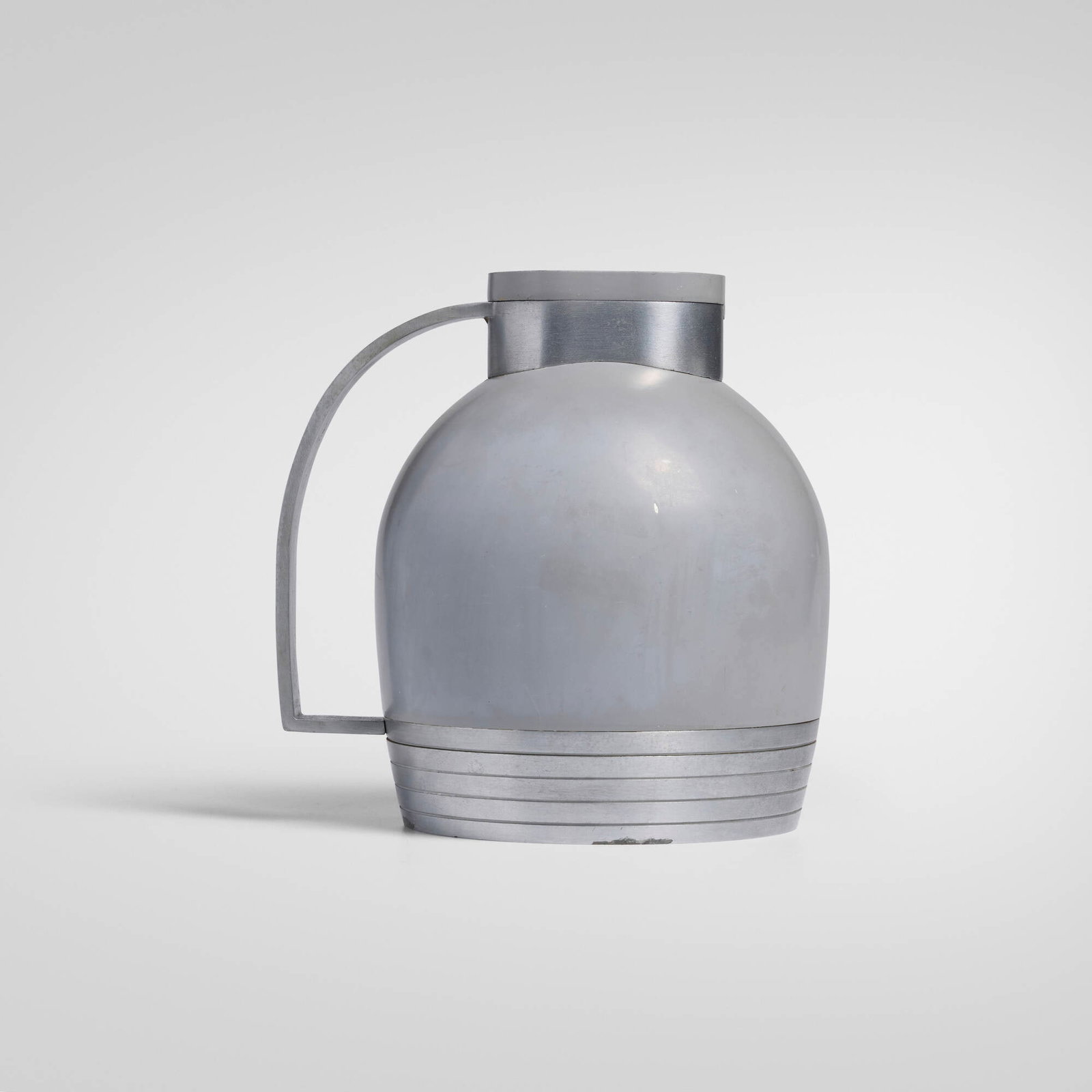 Henry Dreyfuss, Carafe, model 549: Henry Dreyfuss Carafe, model 549 The American Thermos Bottle Co. USA, 1936 enameled aluminum, enameled steel, silver mirrored glass, cork 7.25 h x 6.75 w x 5.5 d in (18 x 17 x 14 cm) Molded