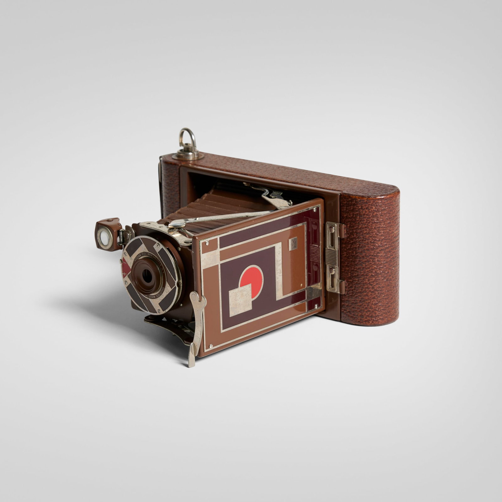 Walter Dorwin Teague, Kodak camera, model 1A: Walter Dorwin Teague Kodak camera, model 1A Eastman Kodak Co. USA, c. 1930 gilt, chrome-plated and enameled metal, wood, camera, leather camera: 3.5 h x 8.25 w x 1.75 d in (9 x 21 x 4 cm) box: 2.5 h x