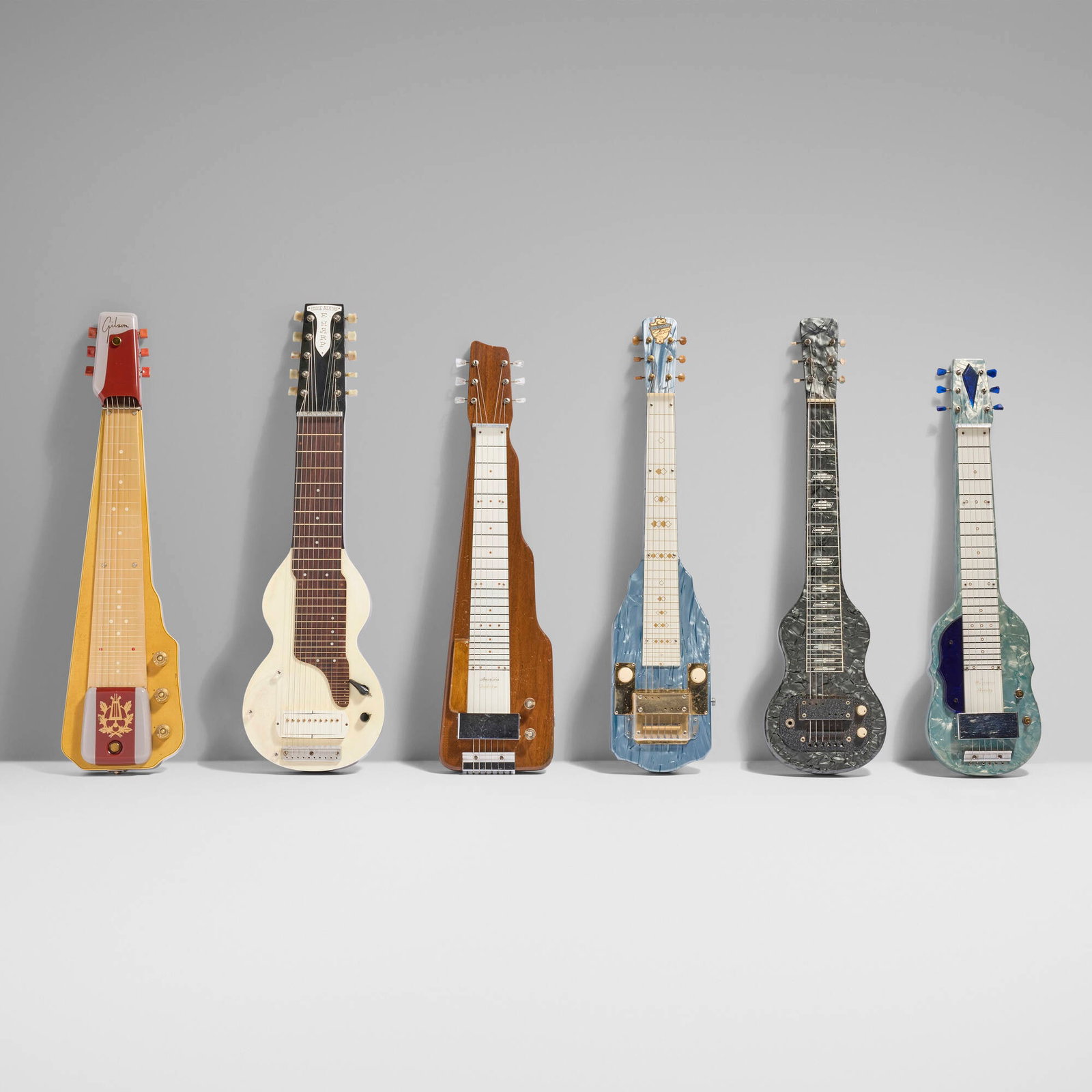 Collection of six lap steel guitars: Collection of six lap steel guitars c. 1949-55 acrylic, chrome-plated and nickel-plated steel, wood, aluminum largest: 32.75 h x 9.75 w x 3 d in (83 x 25 x 8 cm) smallest: 29 h x 8 w x 3 d in (74 x